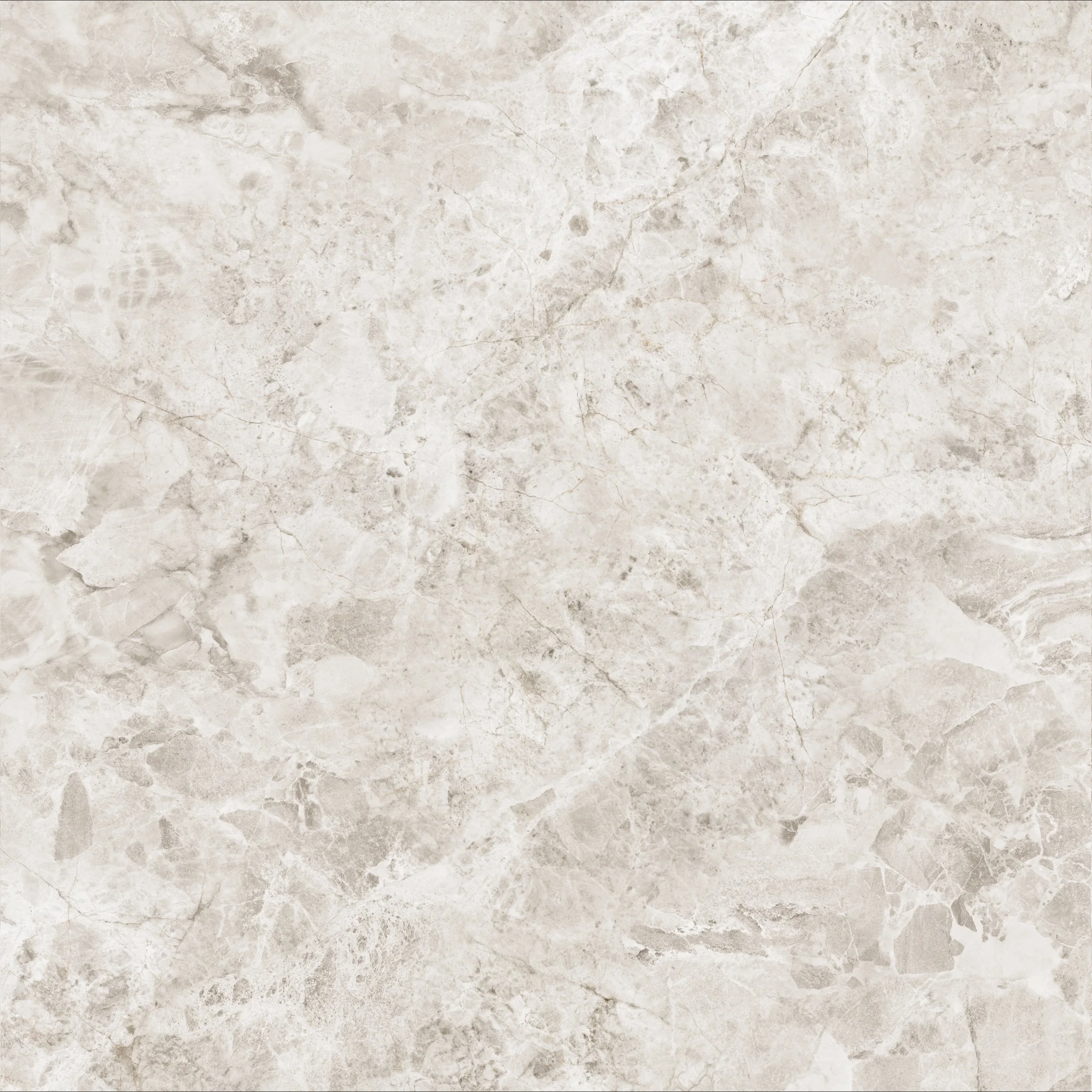 Close-up of Pietra Tundra Ivory marble-look porcelain tile showing layered ivory, cream and warm beige tones with intricate natural stone-inspired veining.