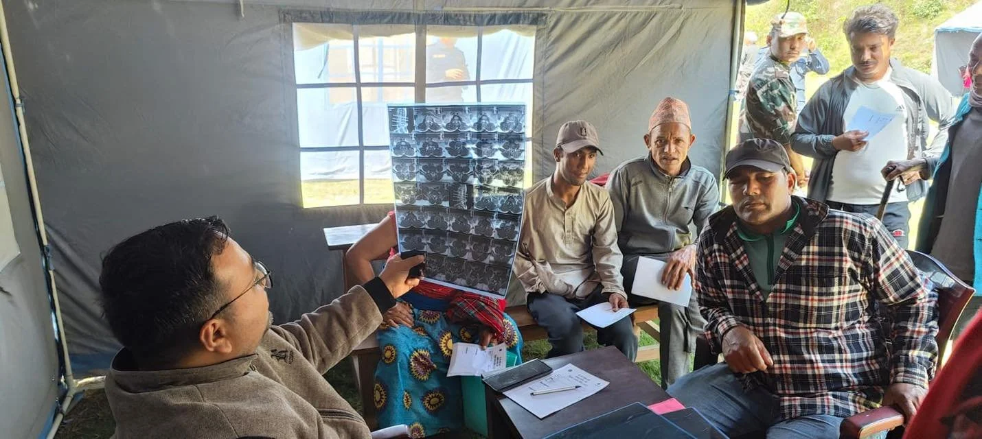 Doctor looking report at health-camp