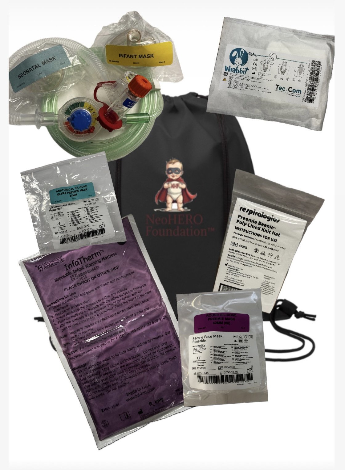Collection of medical supplies and equipment, including masks, a nebulizer, a black NeoHERO Foundation bag, and a small black lanyard or cord, arranged on a white background.