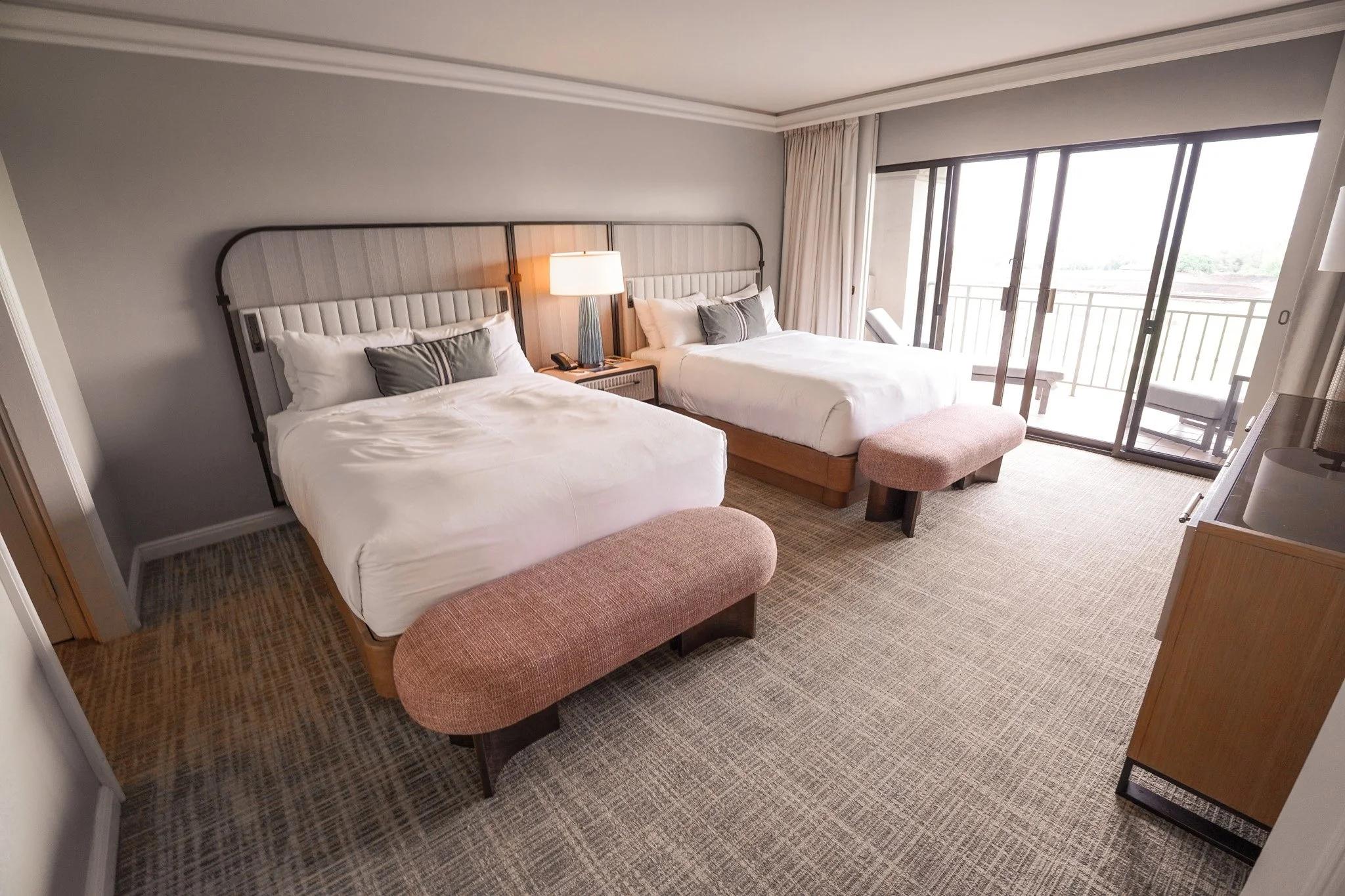 Second suite bedroom with two queen beds and a private lanai view