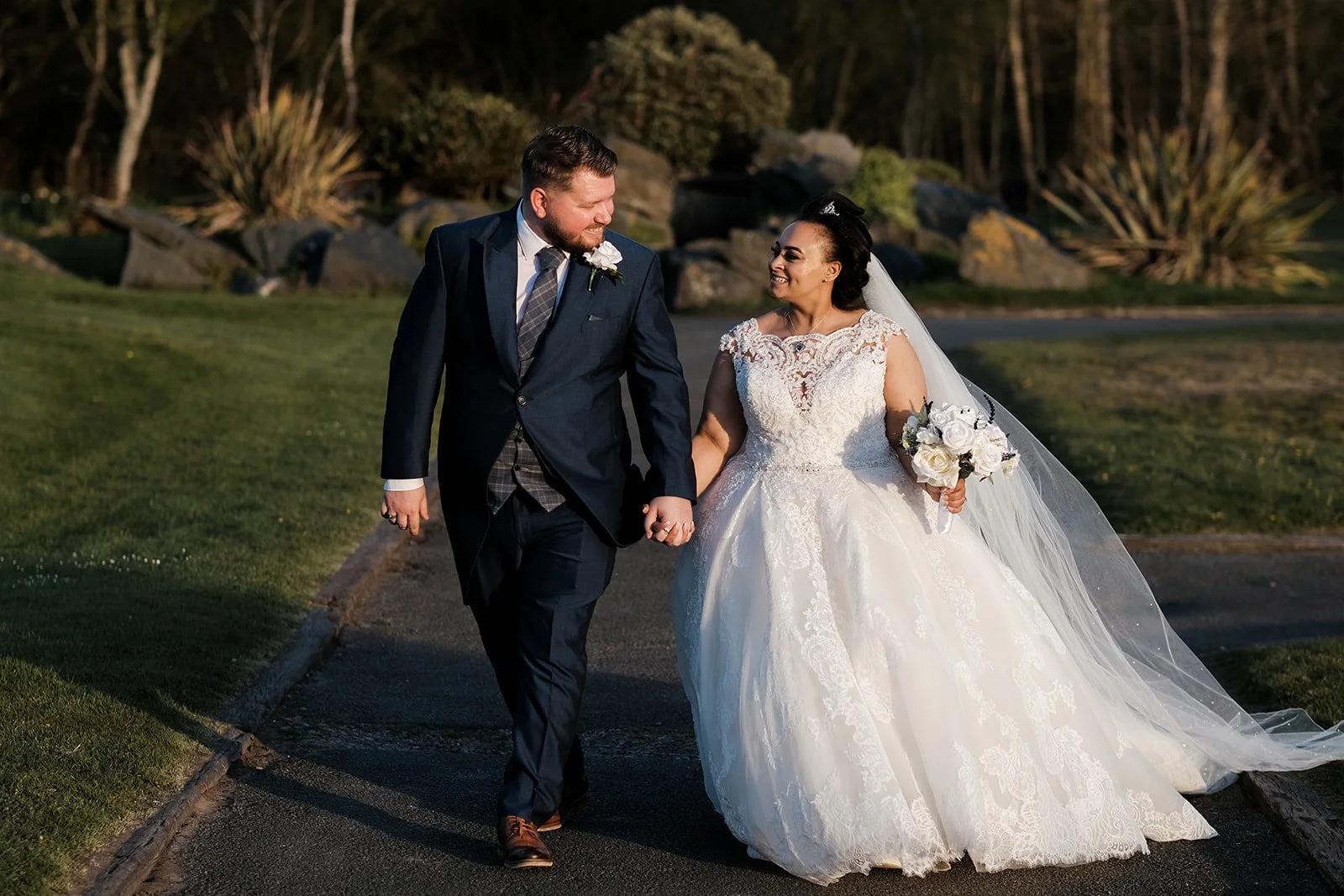 bride and groom walking on the grounds at Formby Hall Golf Resort and Spa