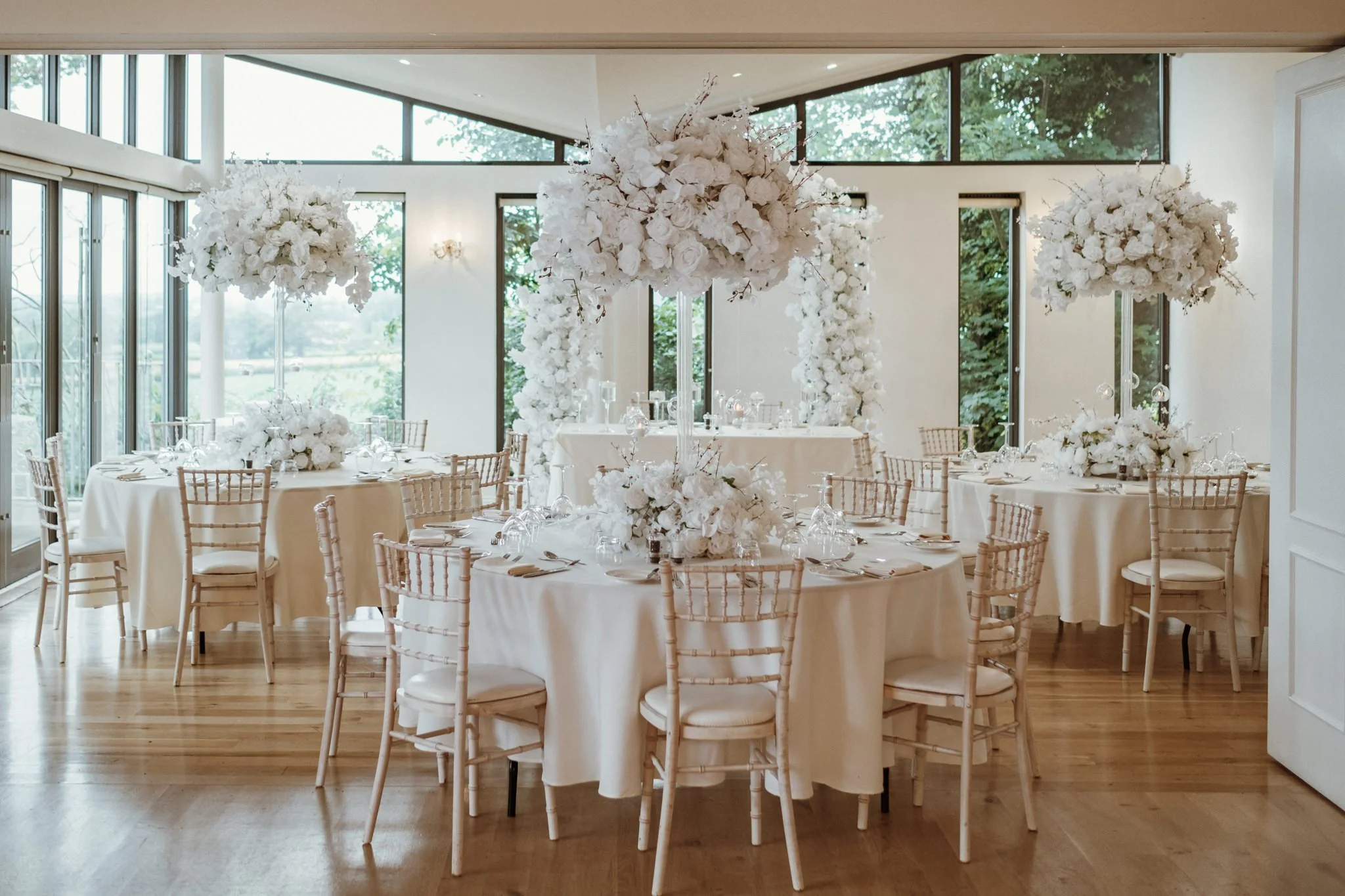 Wedding breakfast styling at west tower using white florals and candles.