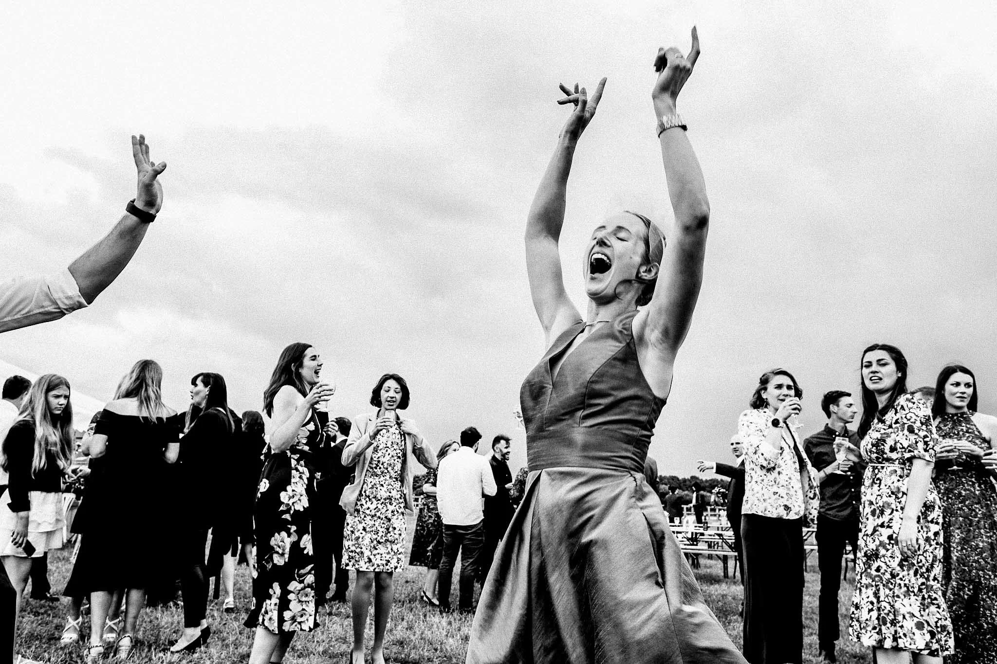 a picture of a wedding guest dancing