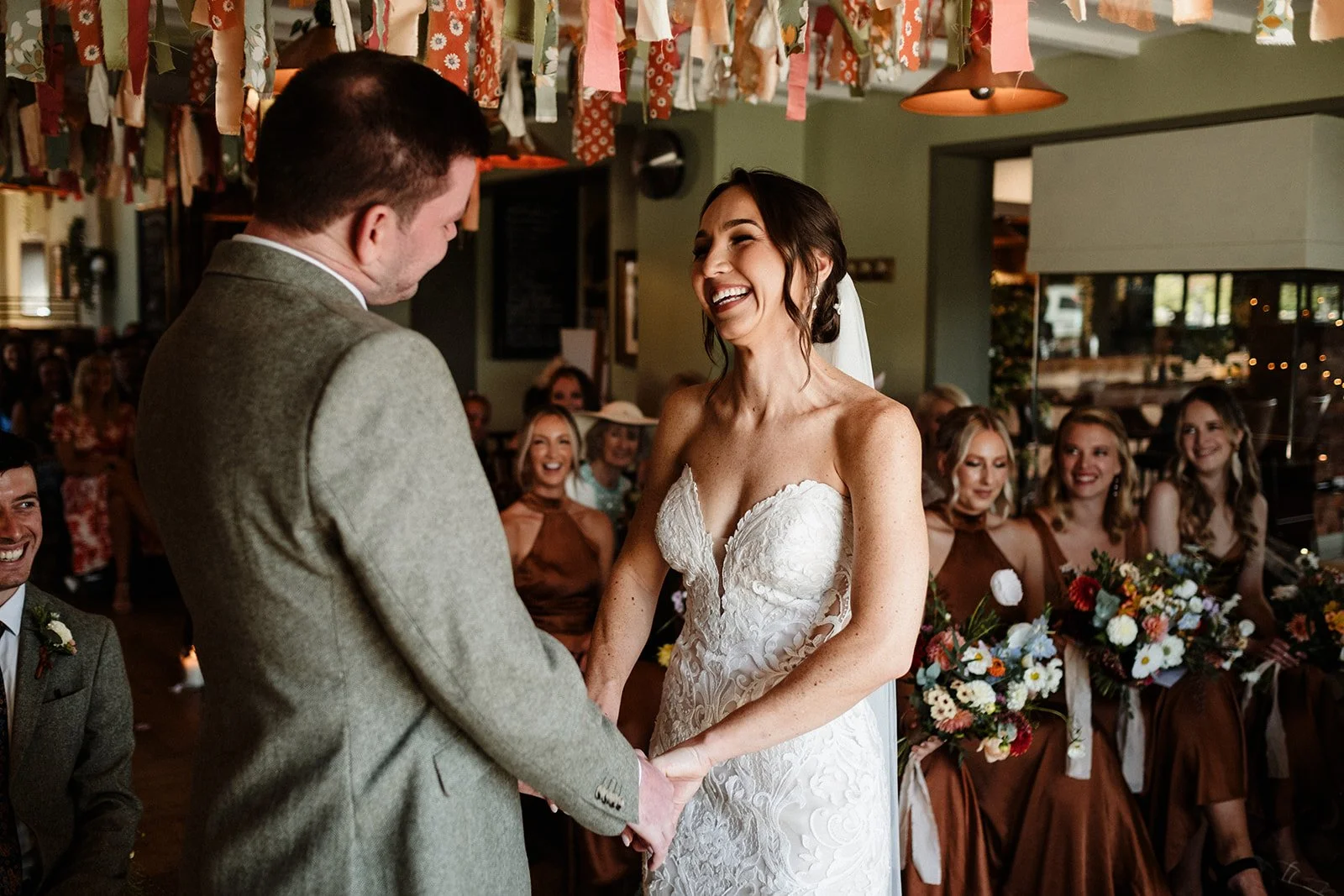 A smiling in her dress from our Liverpool wedding shop.