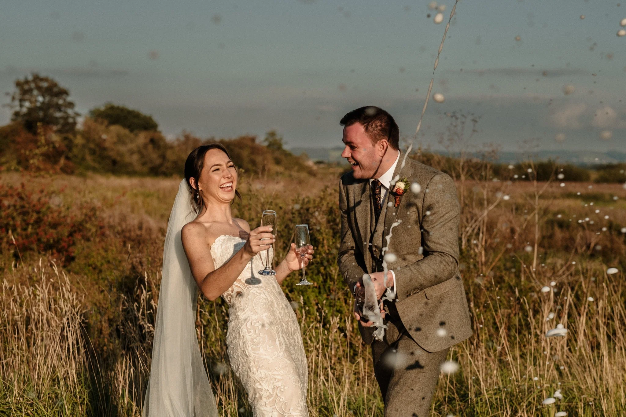 a bride celebrating after getting her wedding dress from our wedding shop near Liverpool.