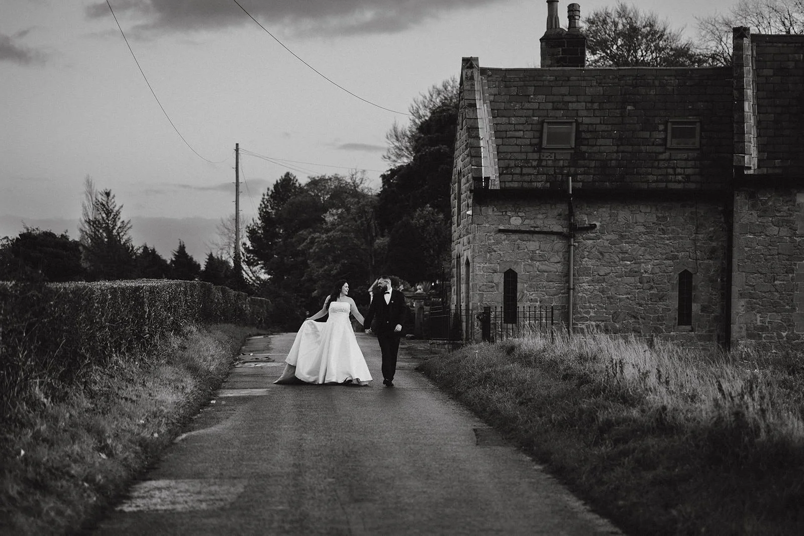 bride and groom walking outside at west tower