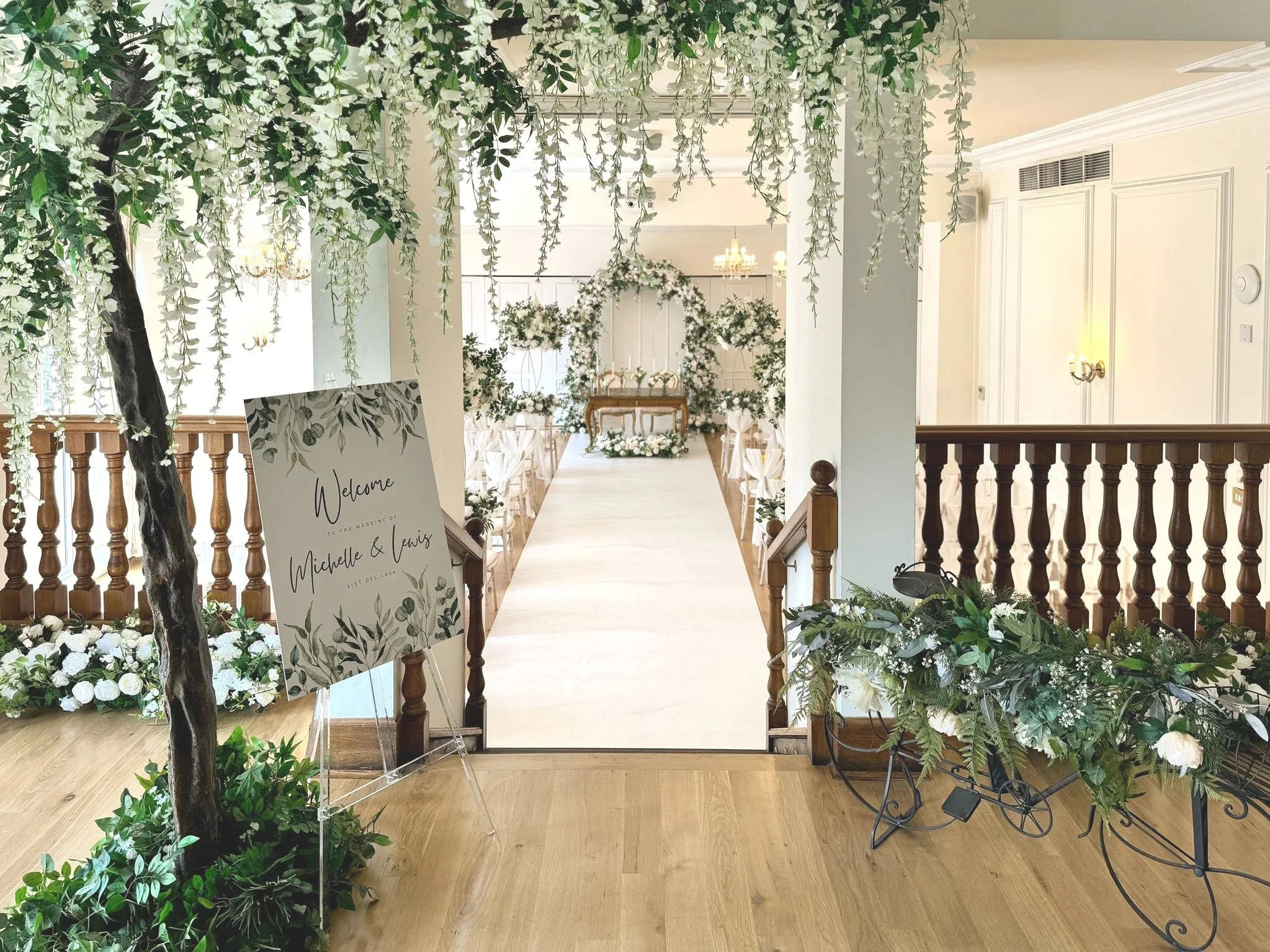 Wedding at at west Tower in Lancashire dressed in green and white flowers with a huge ten foot canopy tree.