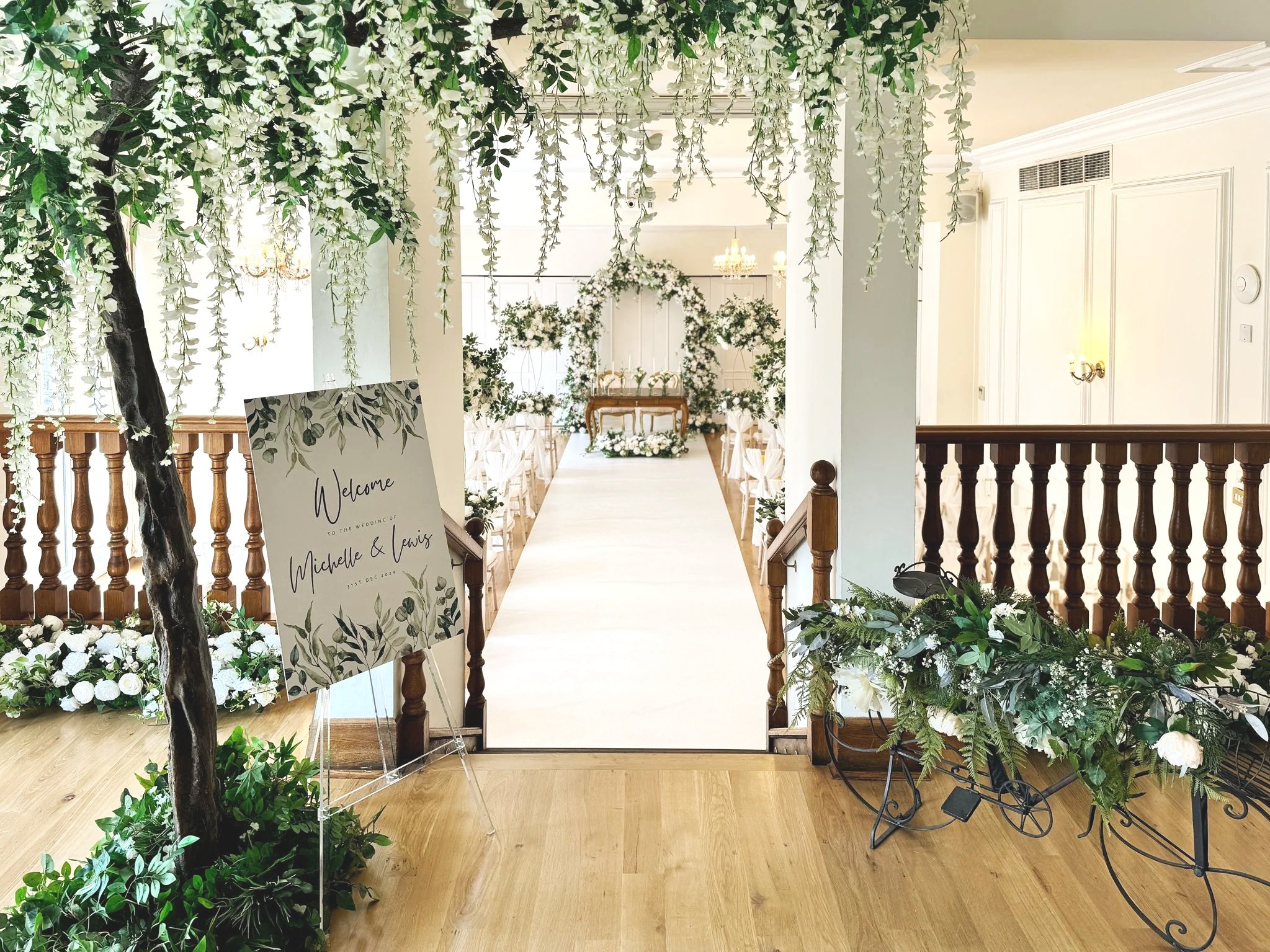 wedding styling for a the aisle at West Tower using green and white florals.