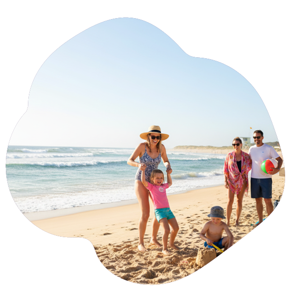 Au pair having fun with kids on the beach