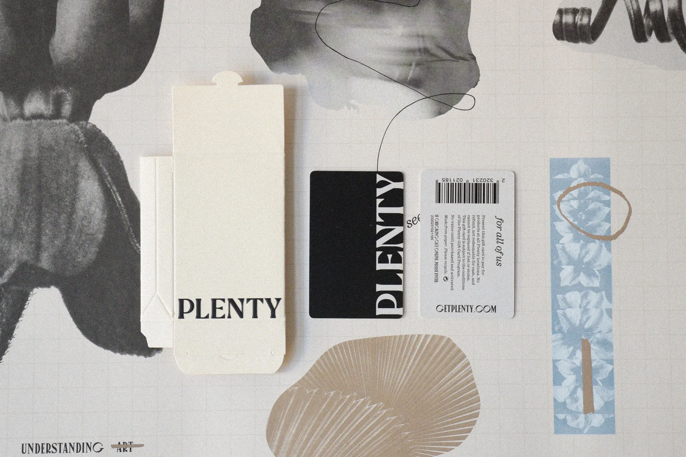 Arrangement of a cream coloured gift card envelope with 'PLENTY' printed on it, a black gift card with 'PLENTY' in bold text on it, a gift card showing the back with information.