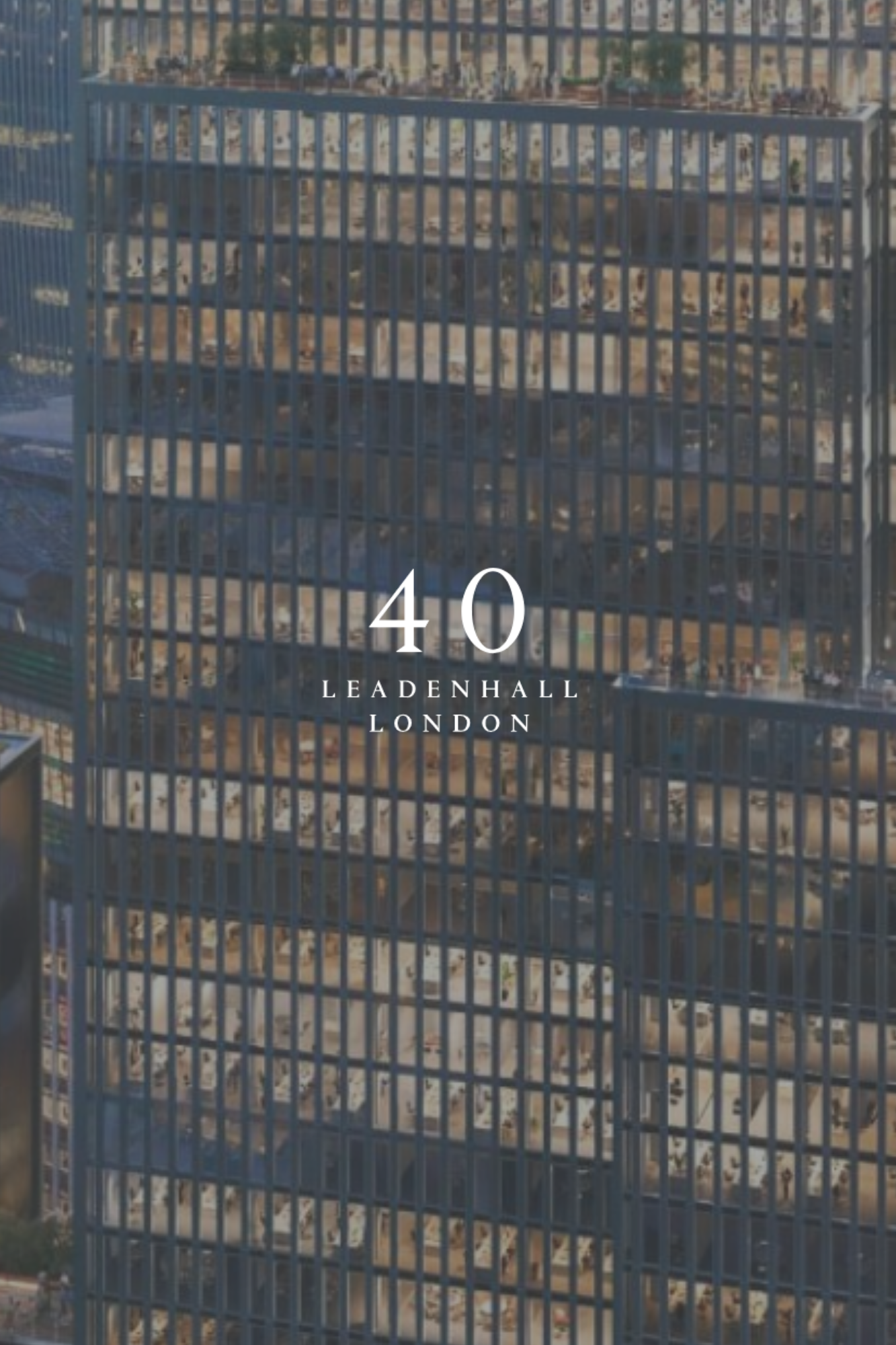 High-rise building with "40 Leadenhall London" written on the front, featuring glass windows and visible office spaces inside.