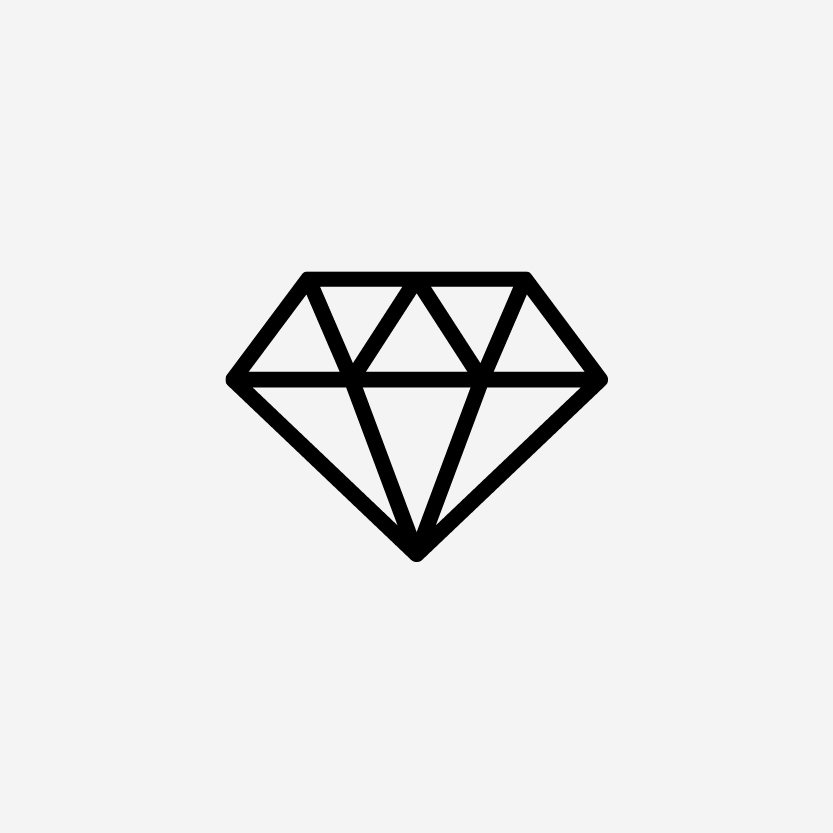 Ein schwarzer Diamant auf grünem Hintergrund.