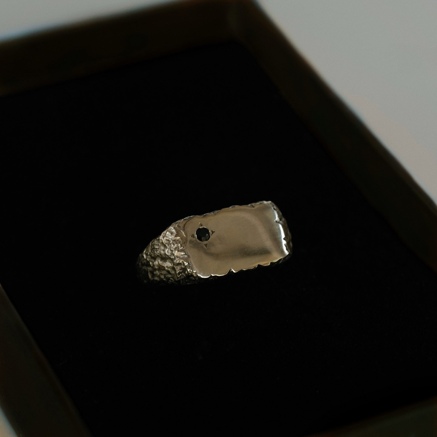 When the customer says they want more rugged - you give them more rugged 🤝🪨

Custom mens engagement signet in 9k white gold with a Sri Lankan Black Sapphire - finally thriving in its forever home in beautiful BC.

Thank you @nikkisegovia &amp; @ses