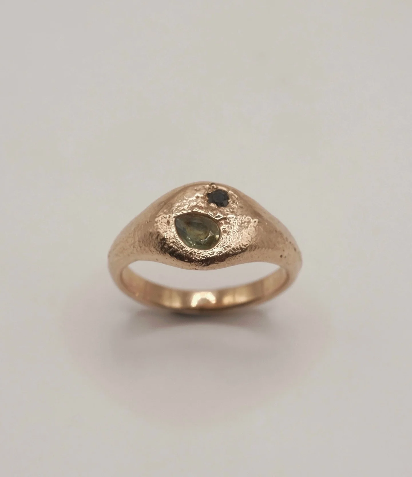 A special little sand cast gold ring with green parti and black sapphire for an extra special friend @andiwardrop 🤍