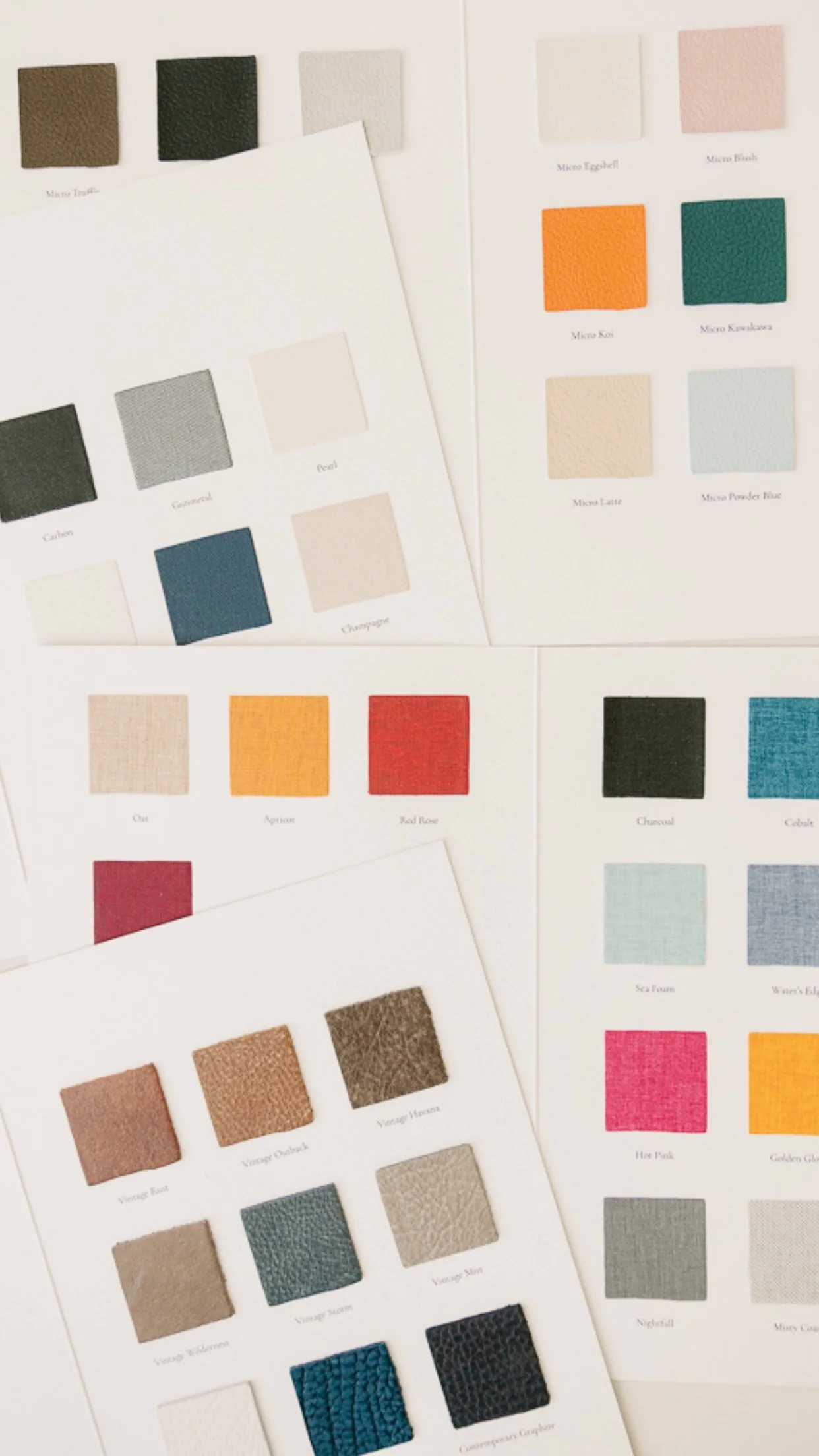 Color samples displayed on sheets, showing various shades including neutrals, bold colors, and textured fabrics. Utilized by Storm Pierre Photography in Jacksonville NC Branding Photos