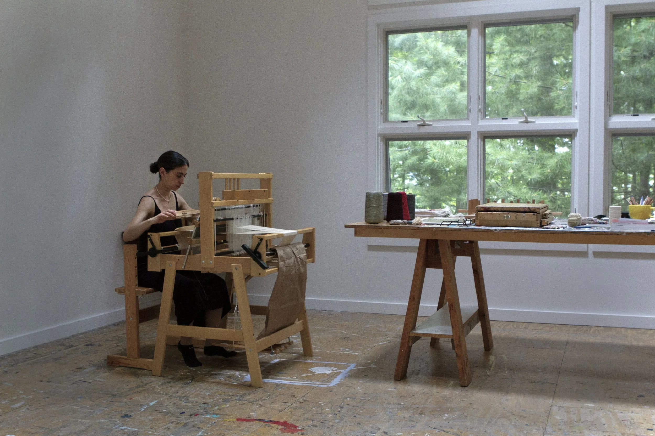 Artist Weaving on Weaving loom, working on a textile project at the The Josef and Anni Albers Foundation Residency / Bethany, Connecticut, USA. Artist in residency 2026, Maria Valenzuela. Albers Foundation