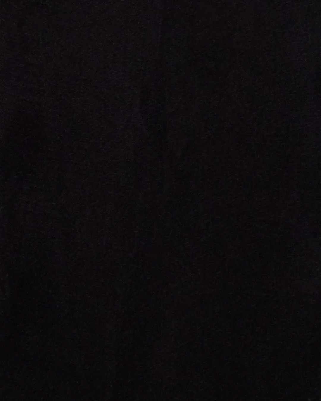 A completely dark image with no visible objects or details.