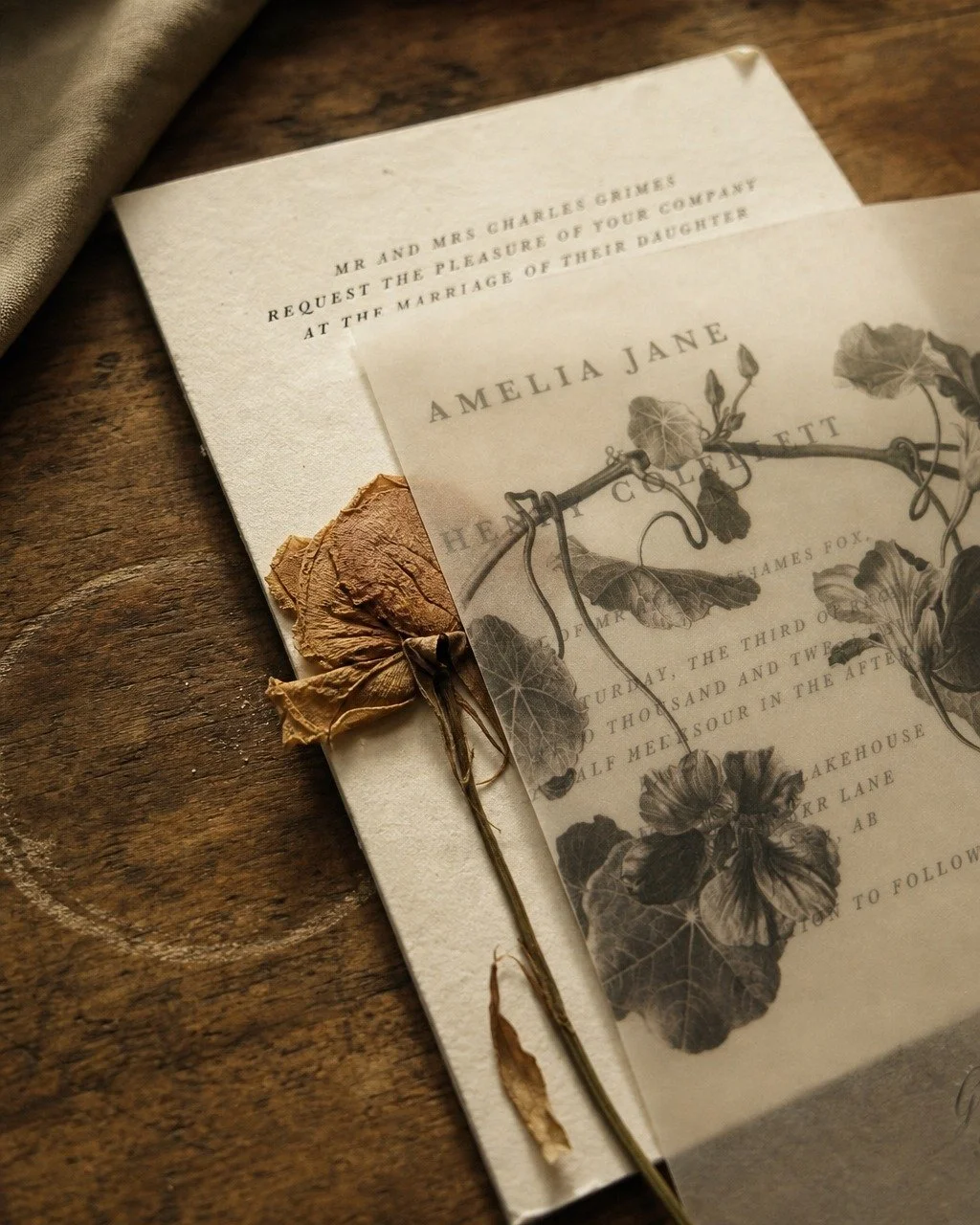 Some things aren't meant to be tucked away after the celebration ends.

A wedding invitation suite, when made with intention&mdash;the weight of cotton paper, the softness of a botanical vellum overlay, ink pressed gently into texture&mdash;becomes s