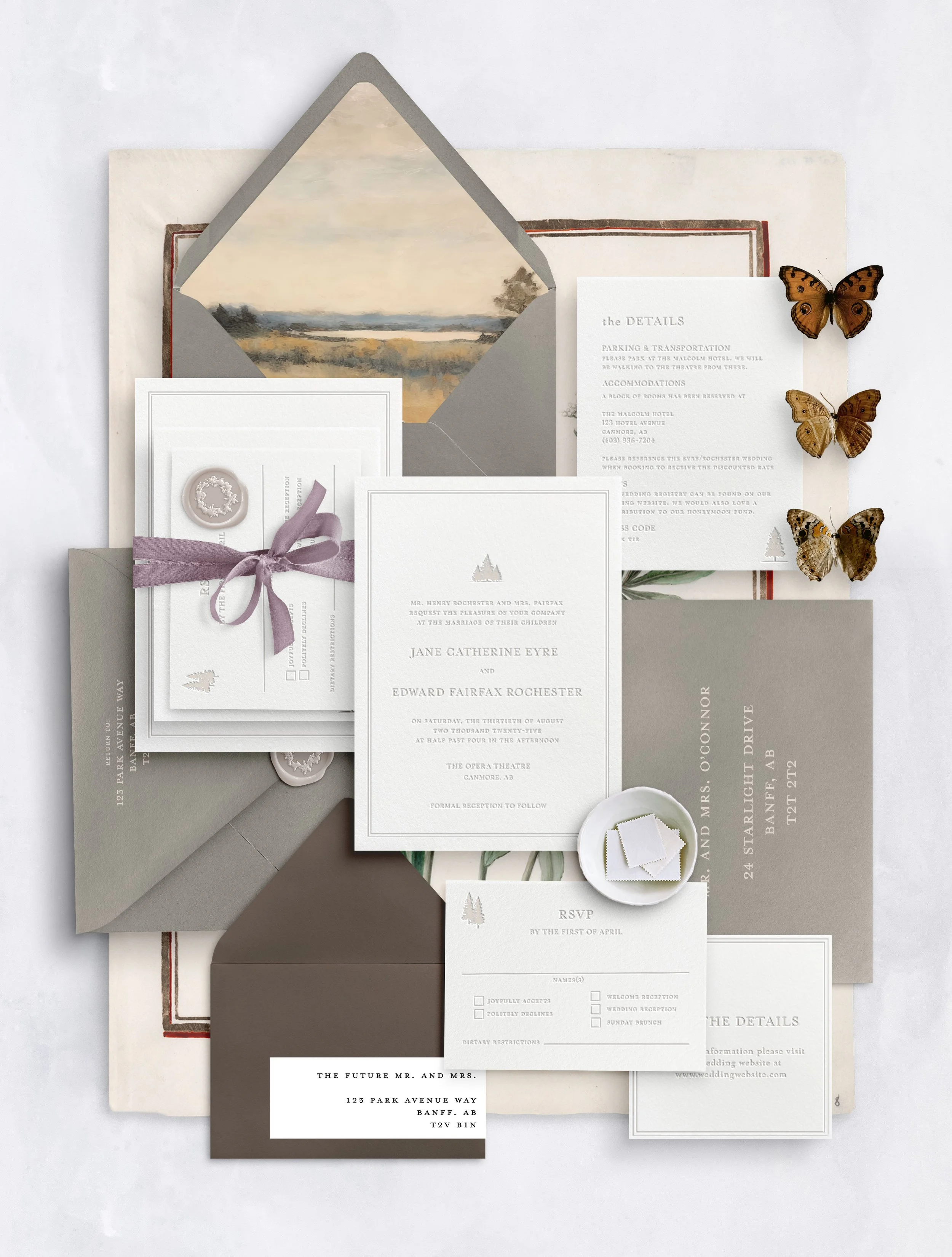 A collection of wedding invitations, RSVP card, envelopes, and decorative butterflies arranged on a white background.