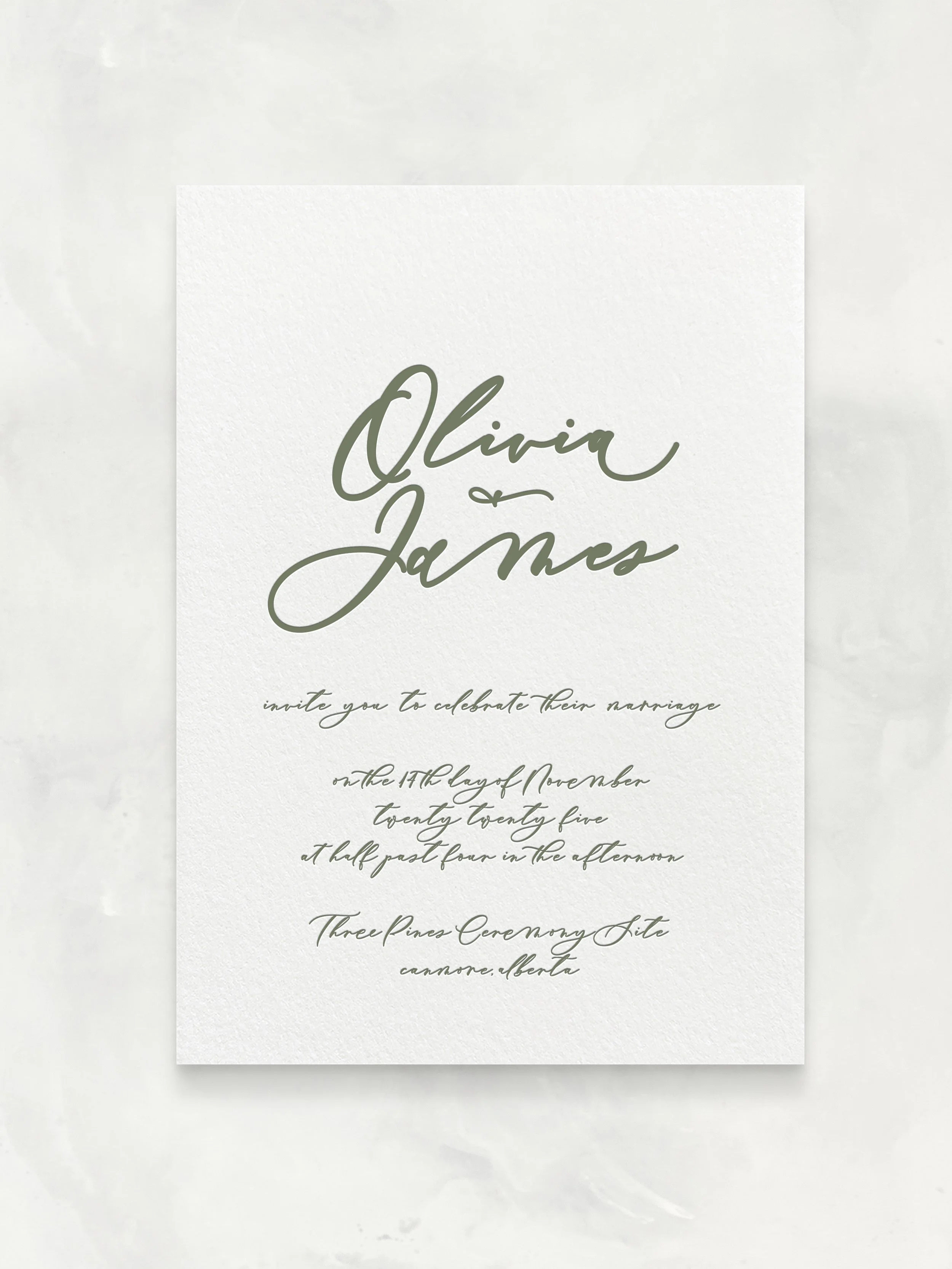 Wedding invitation card with elegant cursive font announcing Olivia and James's marriage, scheduled for November 15th at 4:30 PM at Three Pines Ceremony Site in Canmore, Alberta.