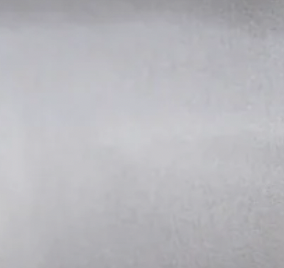 Empty metallic surface, possibly a silver or gray car body or appliance.