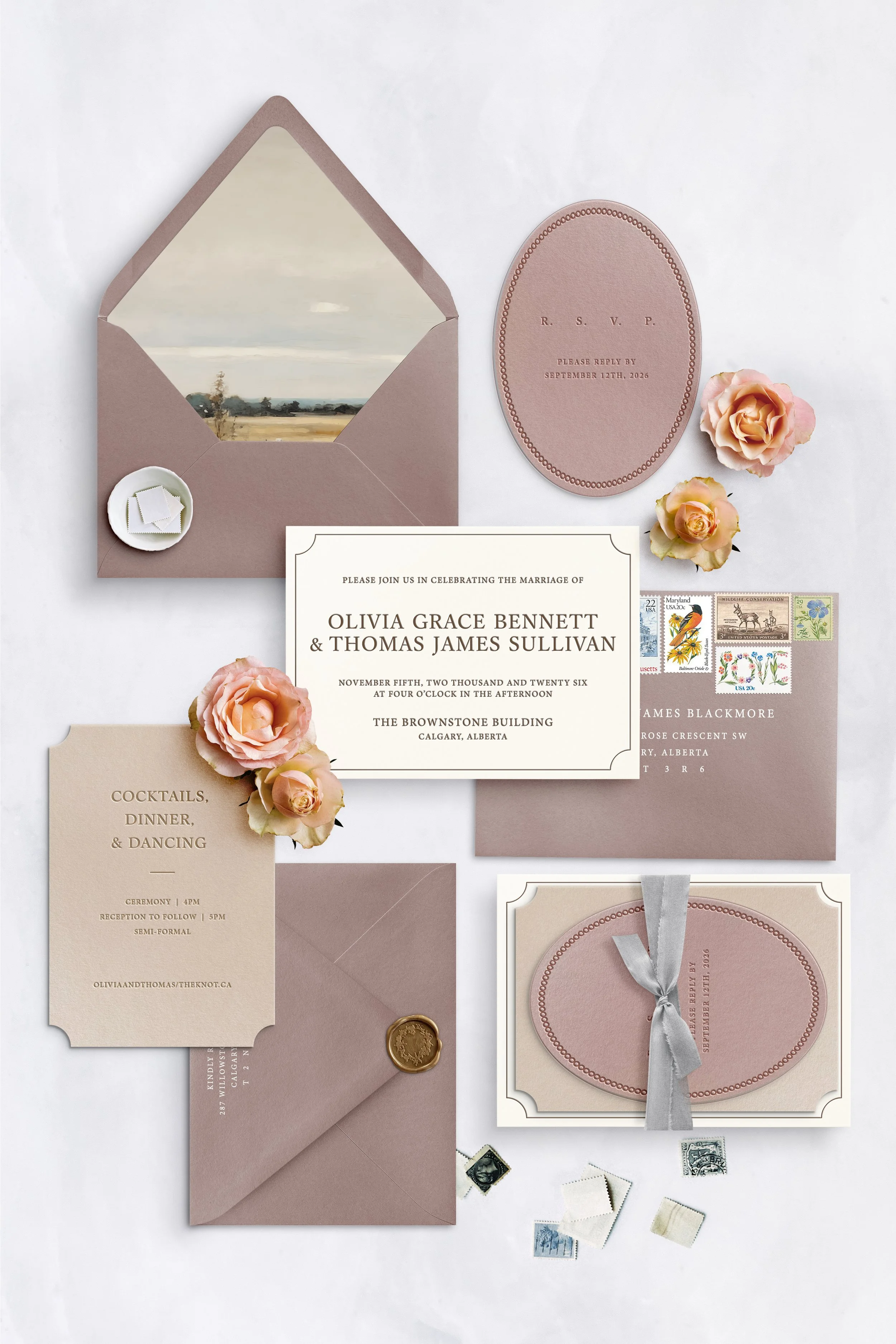 Wedding invitation suite in blush and beige tones, with matching envelope, RSVP card, details card, and floral accents, along with postage stamps and a wax seal.