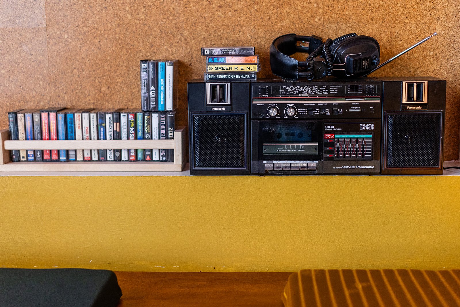 Shelf with tape cassettes and ghetto blaster with headphones for customers to listen to at Front Room, at The Hide, Sheffield