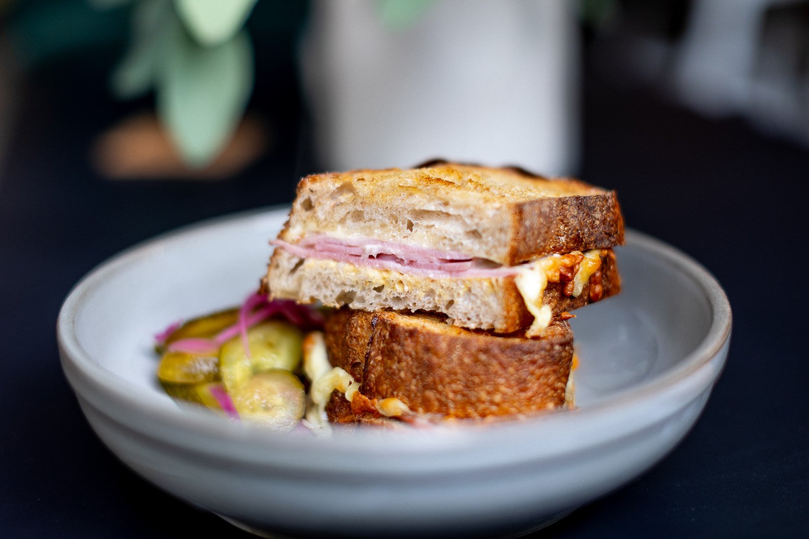 Cheese, Ham and mustard grilled Toasties served with pickle slaw at Front Room, coffee shop at The Hide, Sheffield.
