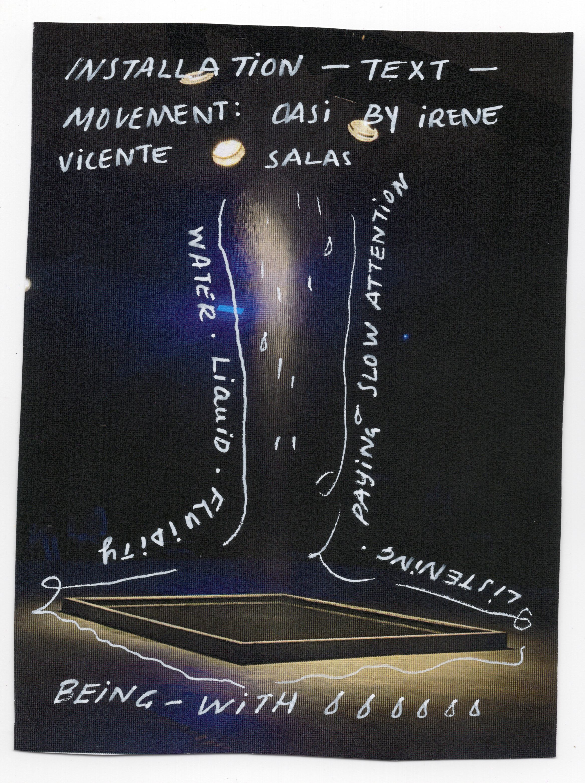 Dark image with a square on the floor of a stage, with handwritten text overlaid on the image