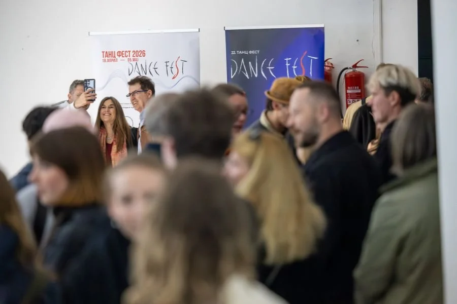 Crowd in a foyer, Dance Fest Skopje banners in the background