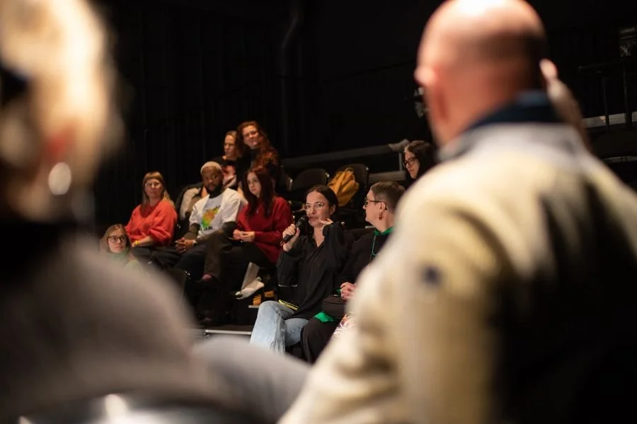 Artists seated in a theatre take part in a post-show discussion