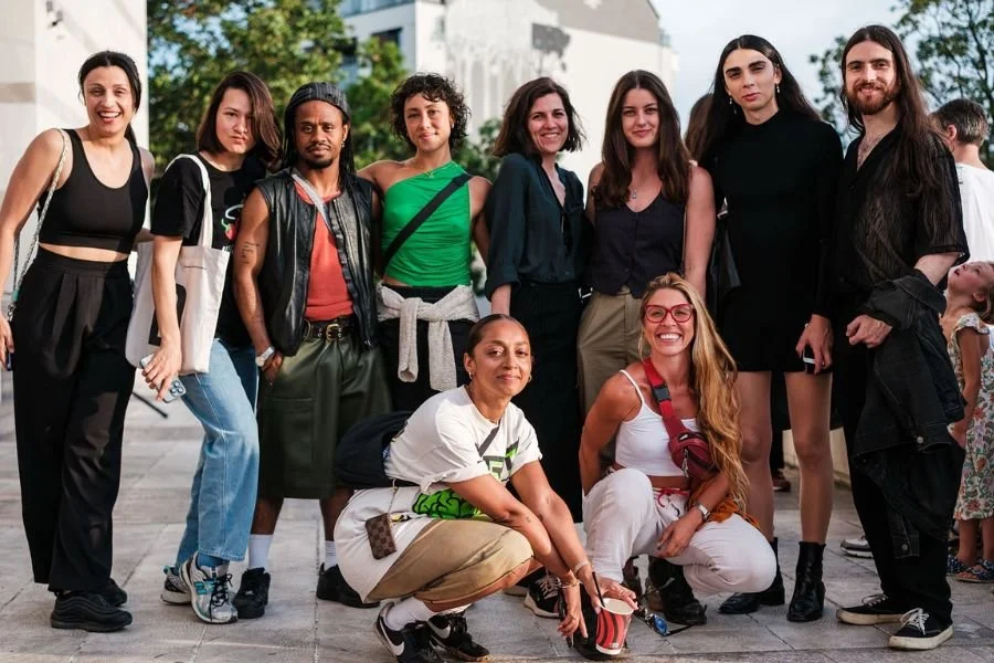 Group of participating VAP artists pose together outdoors smiling