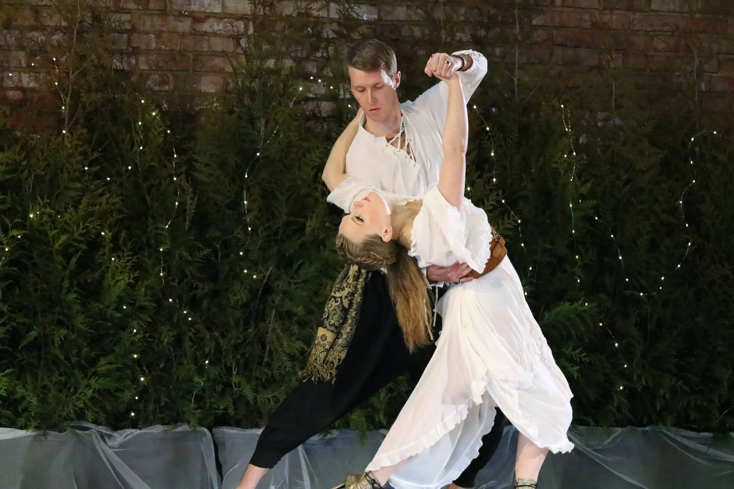 Student, Jason, performing tango with his teacher, Emilie Cole