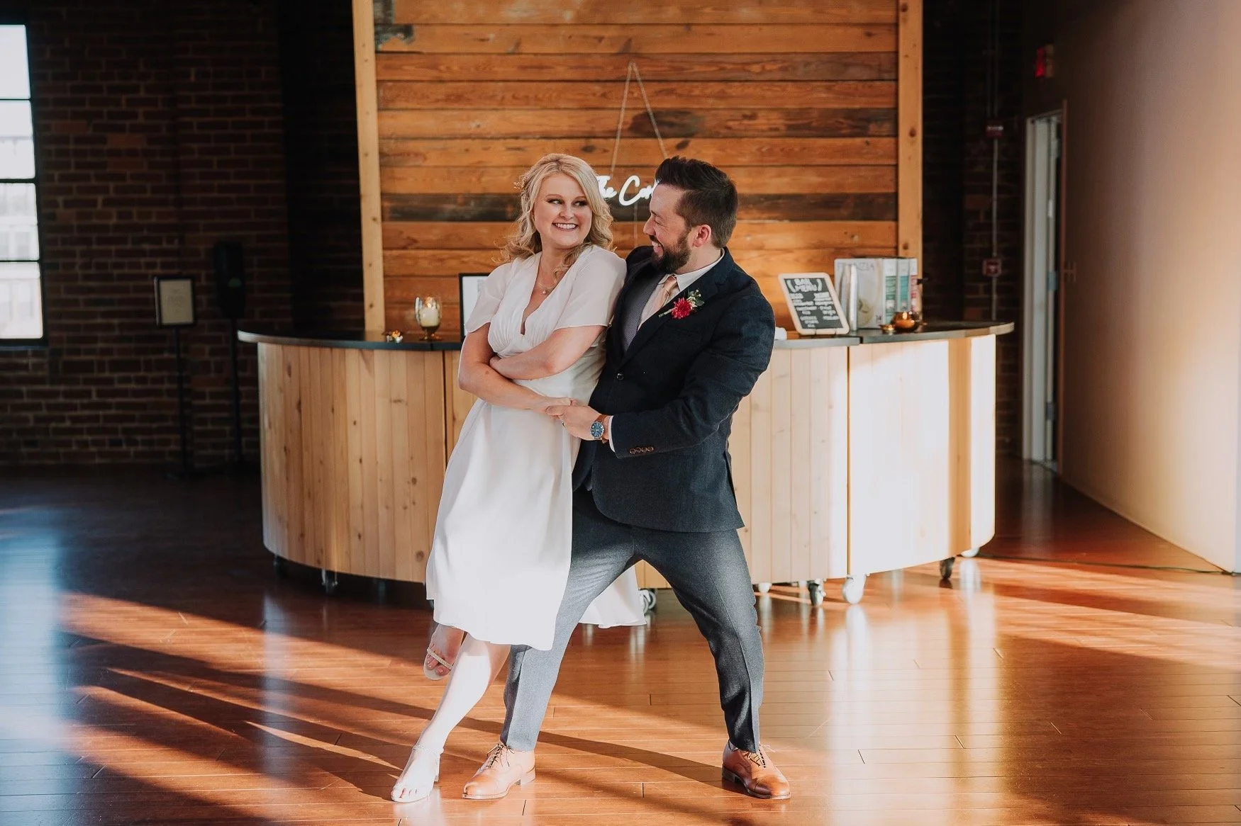 Jason and Kaley share a beautiful, romantic dip during their wedding first dance, a perfect moment inspired by their lessons at Emilie Cole Studios.