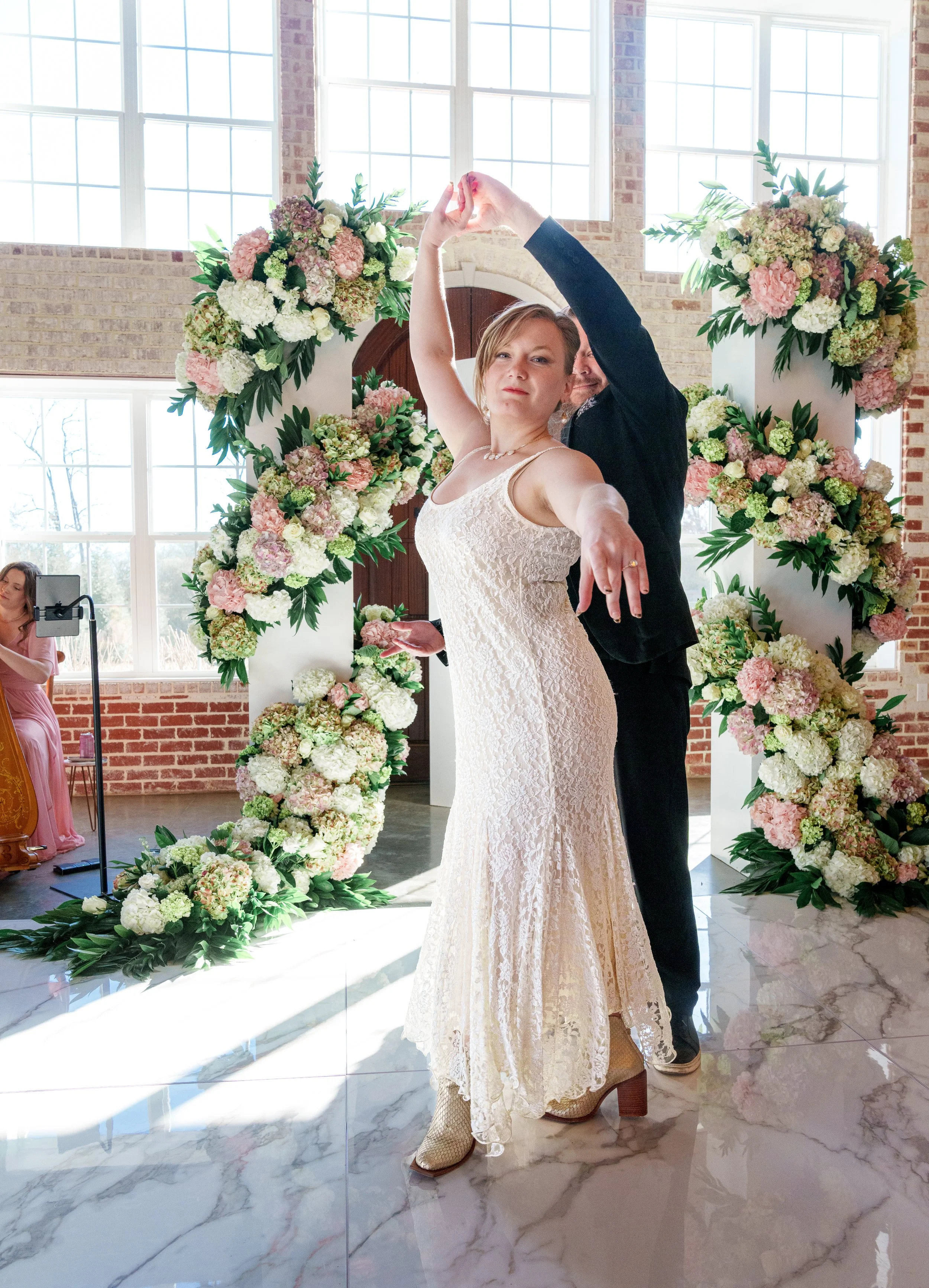 Dance instructor coaching a couple for their first wedding dance in Chattanooga studio