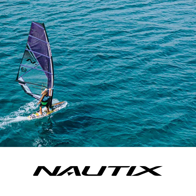 A person windsurfing on the ocean with a large sail, near the Nautix logo.
