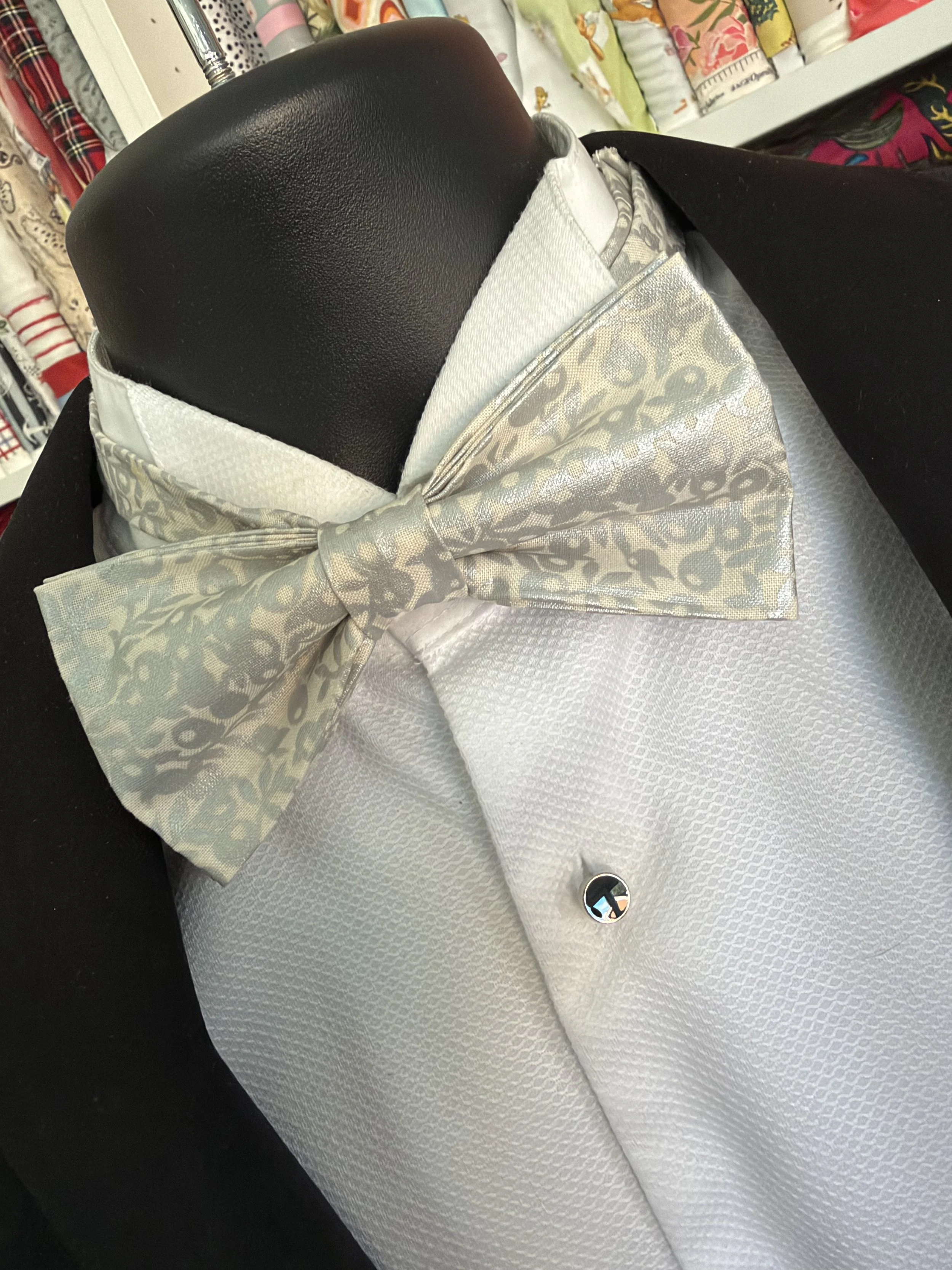 Handmade sewjackie bow tie in liberty fabric, featuring silver metallic berries on a creamy white fabric