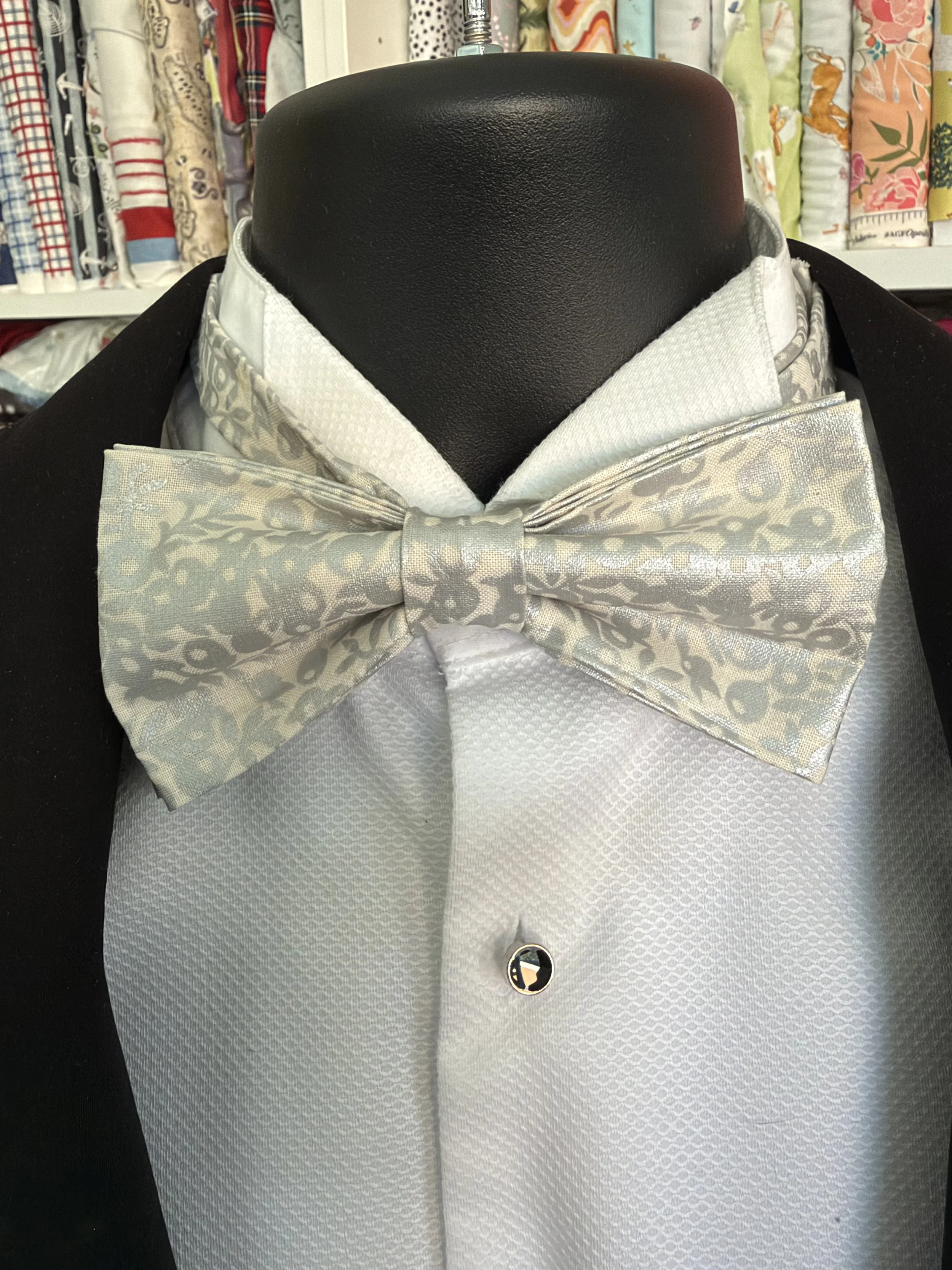 Handmade sewjackie bow tie in liberty fabric, featuring silver metallic berries on a creamy white fabric
