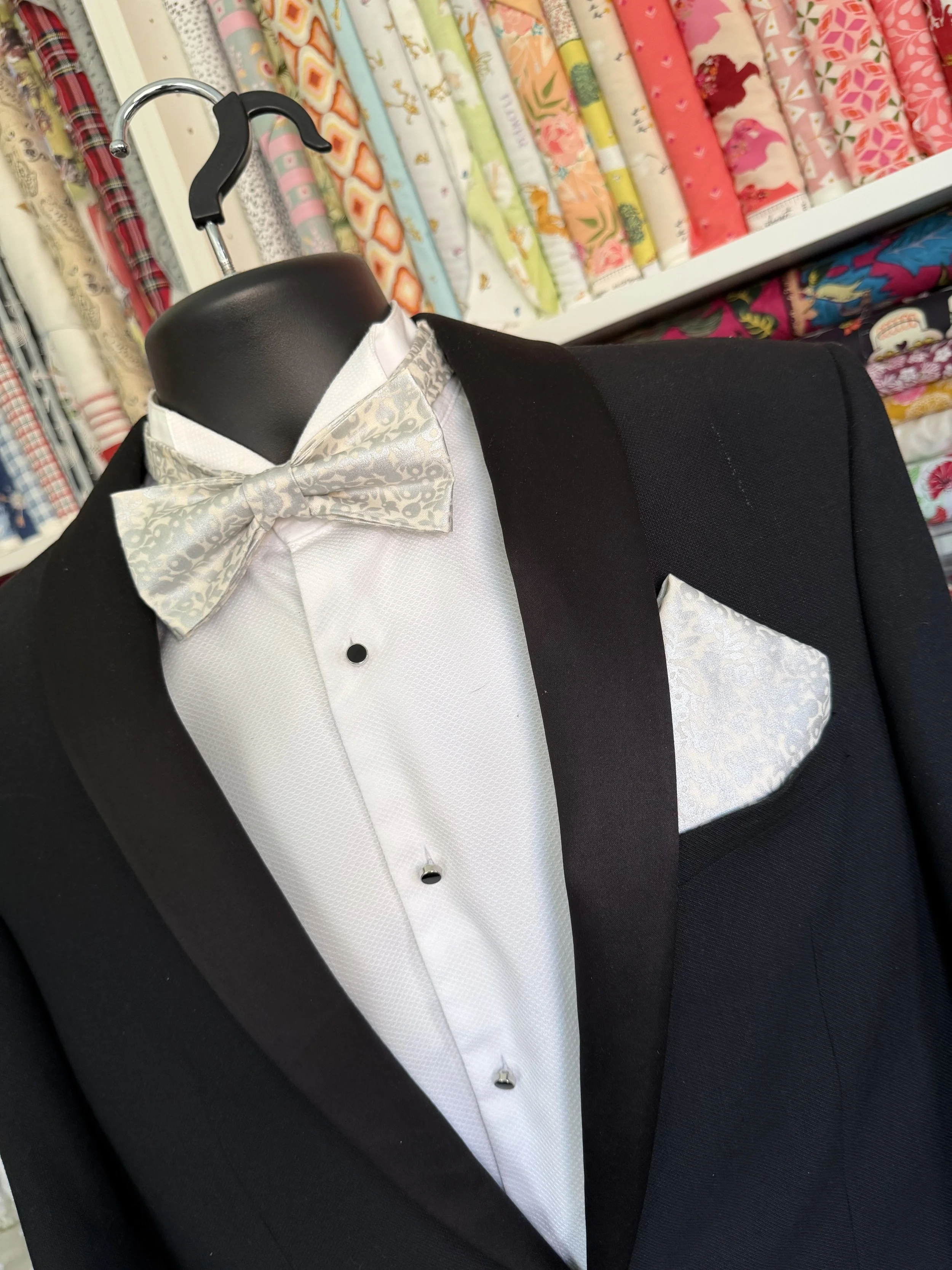 Handmade sewjackie bow tie and matching  pocket square in liberty fabric, featuring silver metallic berries on a creamy white fabric