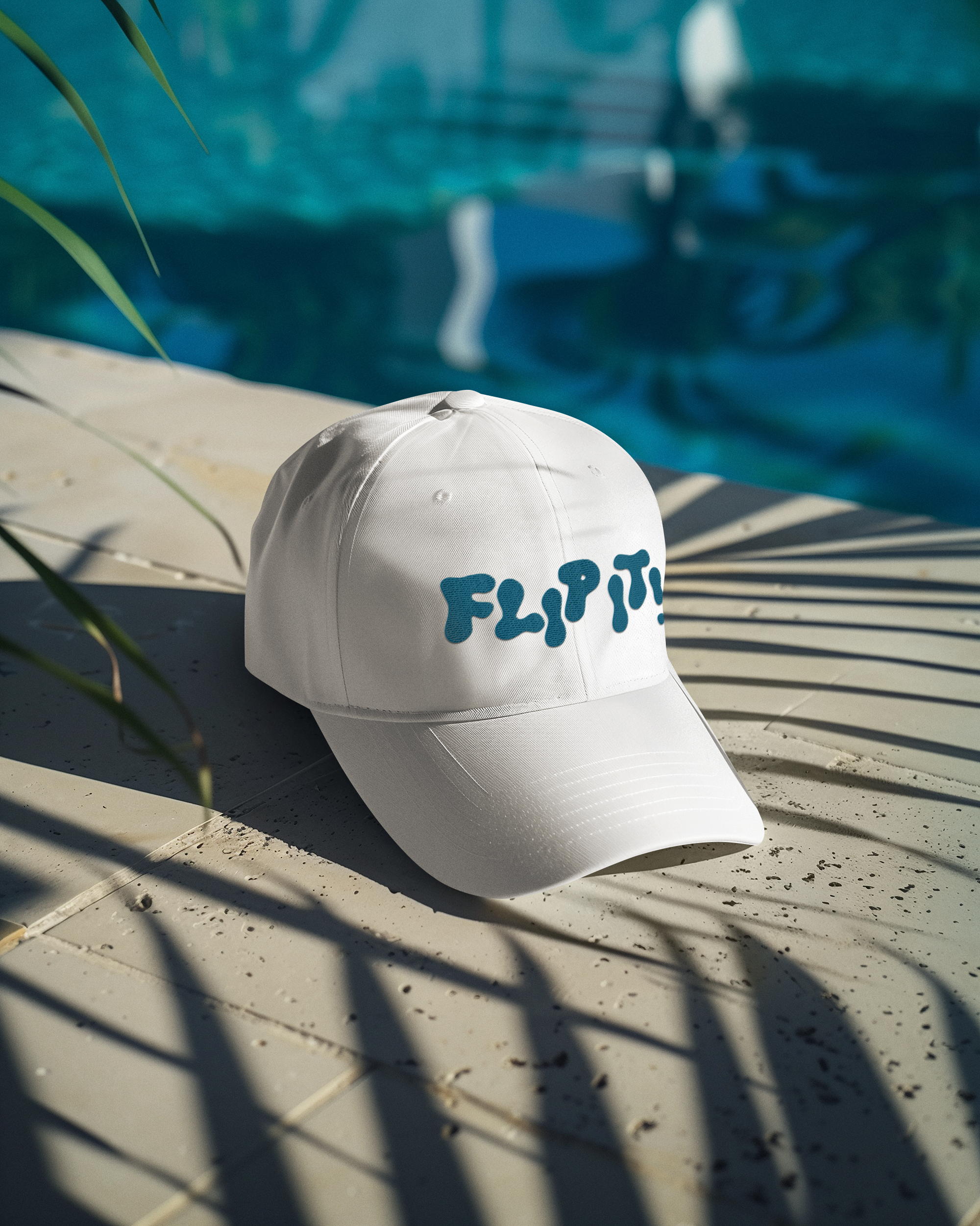summer-mockup-featuring-an-embroidered-dad-hat-lying-near-the-pool-m40688.png