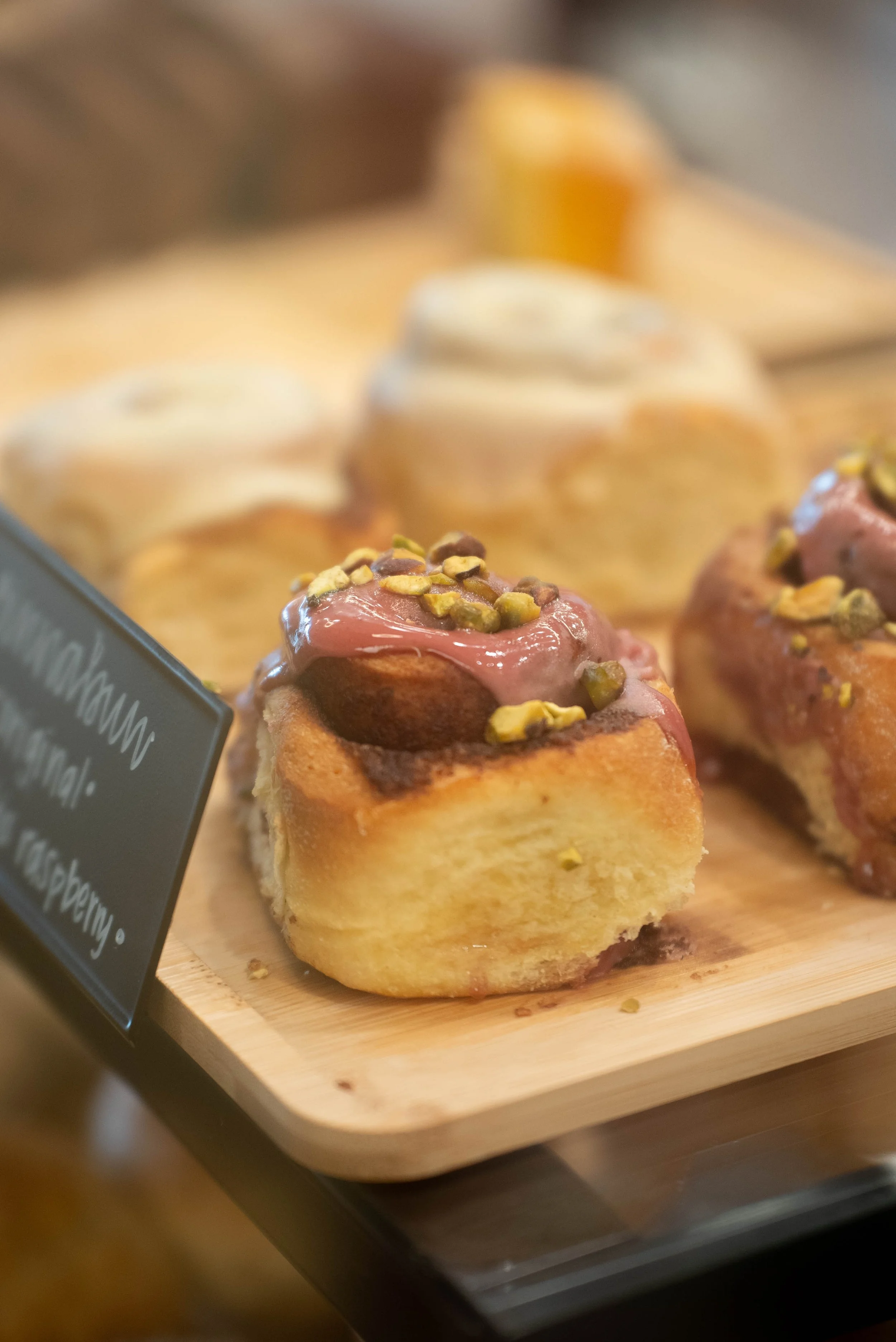 A pistachio and raspberry cinnamon roll from Bru Coffee