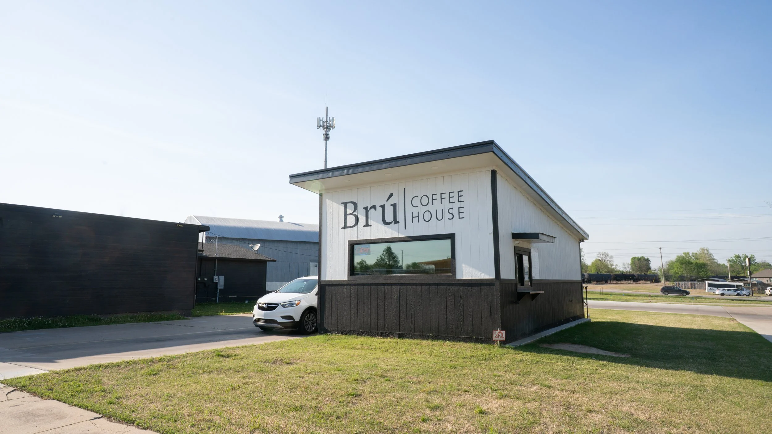 A black and white drive through coffee house