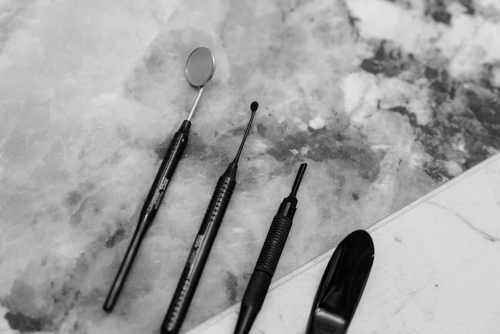 dental tools on a marble work surface