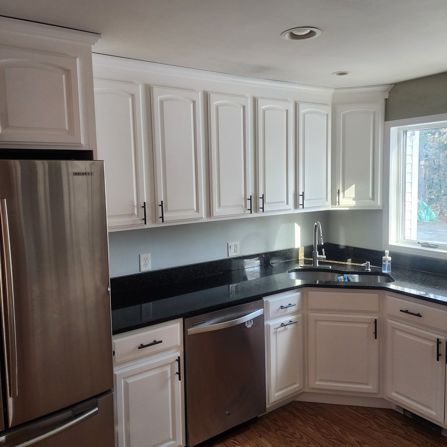 Most people only see the finished kitchen.
Here&rsquo;s a little of what happens before the cabinets go back up.

Doors are removed, sprayed in a controlled setup, and given proper time to dry before reinstalling. Taking the time to do it carefully i