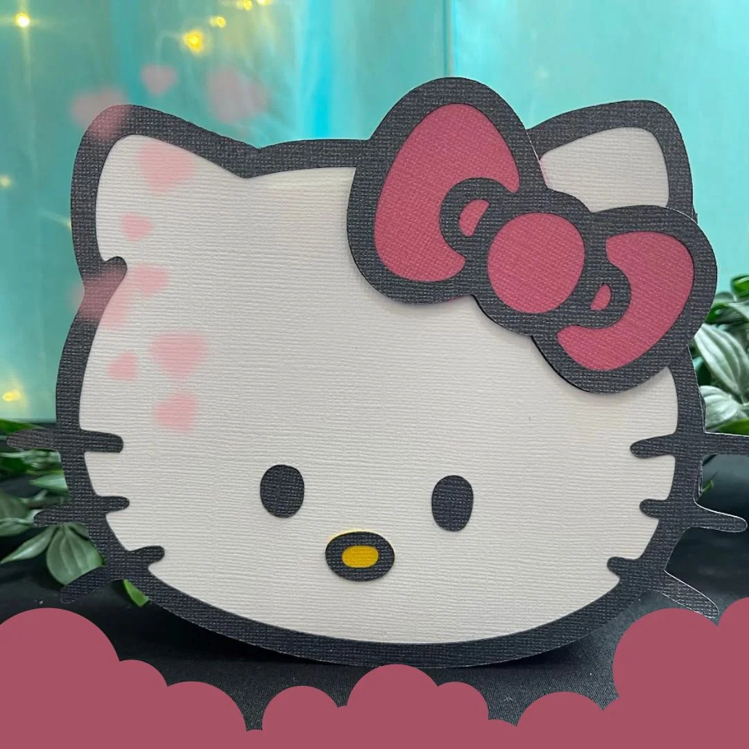 Hello Kitty face cutout with pink bow