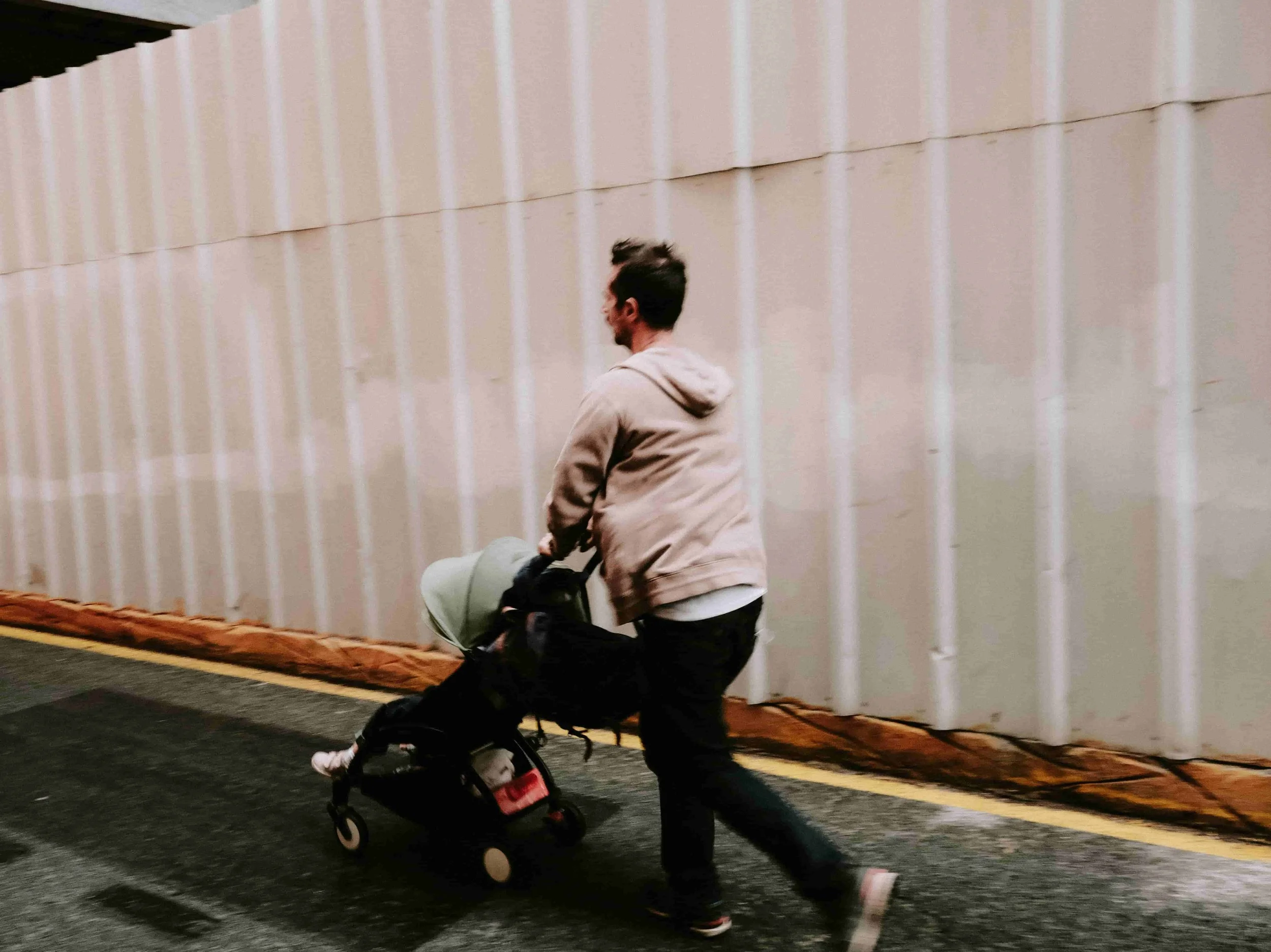 dad pushing stroller