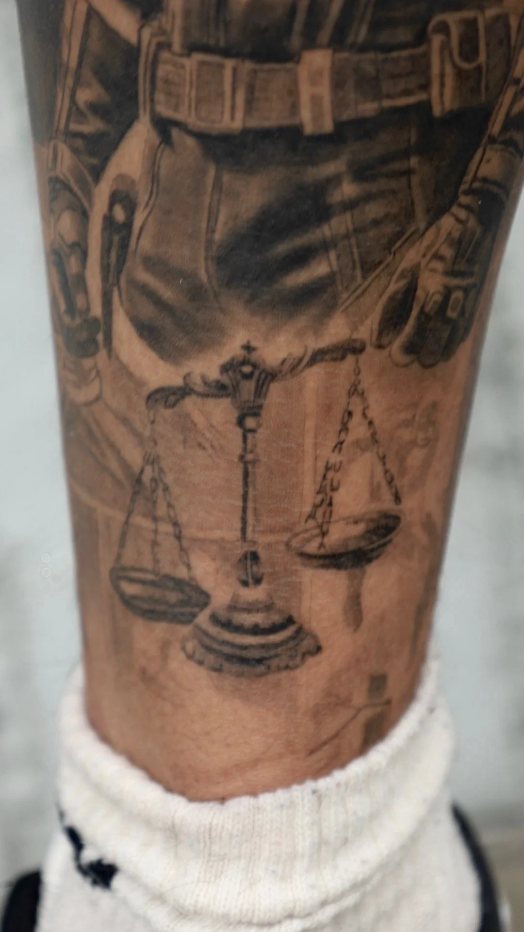 black and gray realism tattoo by Malaki 