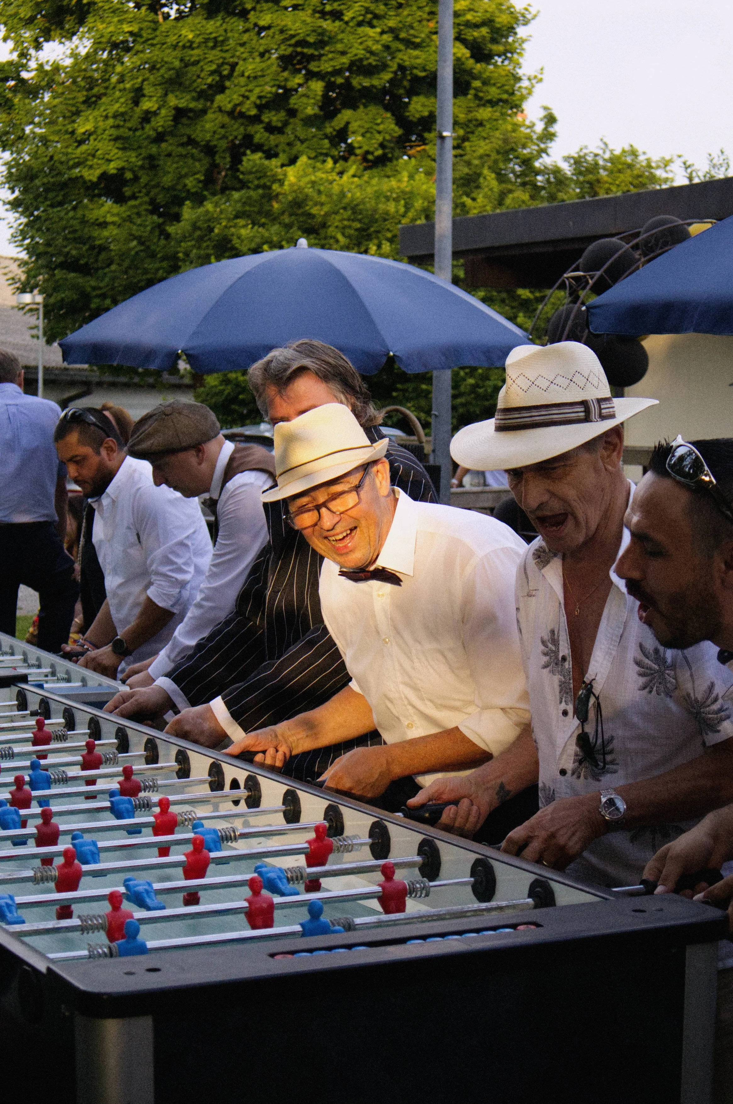 Man Playing Foosball at a Birthday Party