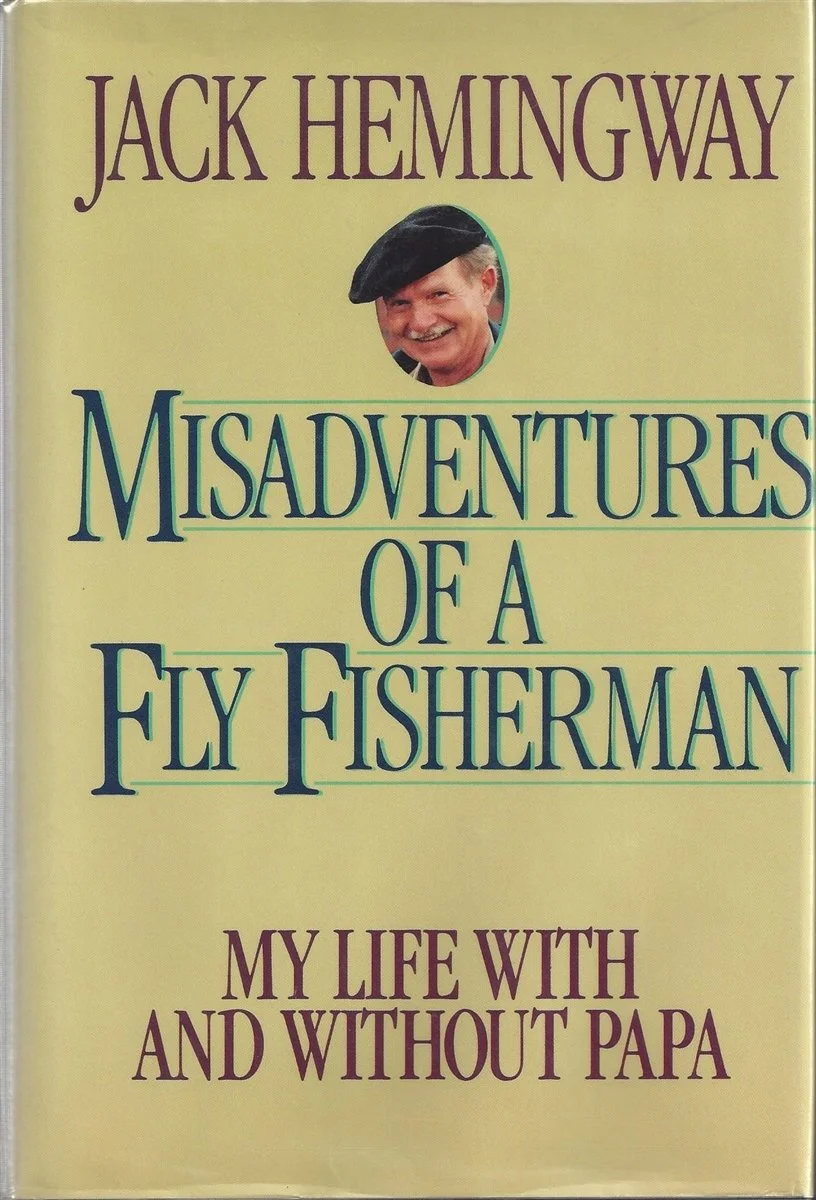 Book cover with the title "Misadventures of a Fly Fisherman: My Life with and Without Papa" by Jack Hemingway. The cover features a small portrait of a smiling man wearing a beret.