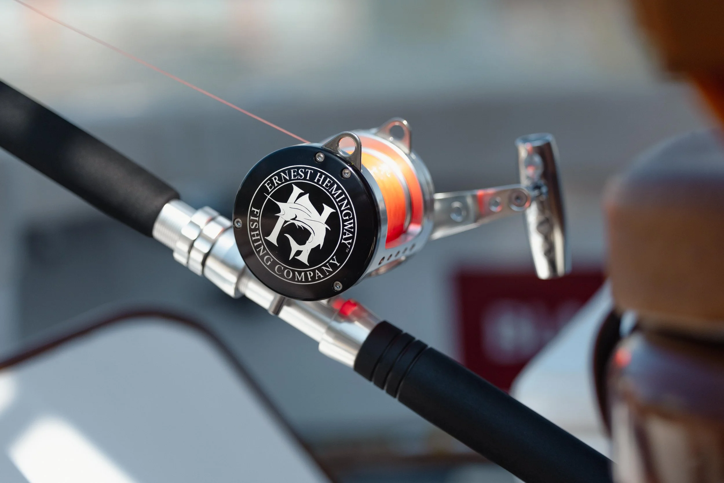 An Ernest Hemingway Fishing Co reel for saltwater fishing.